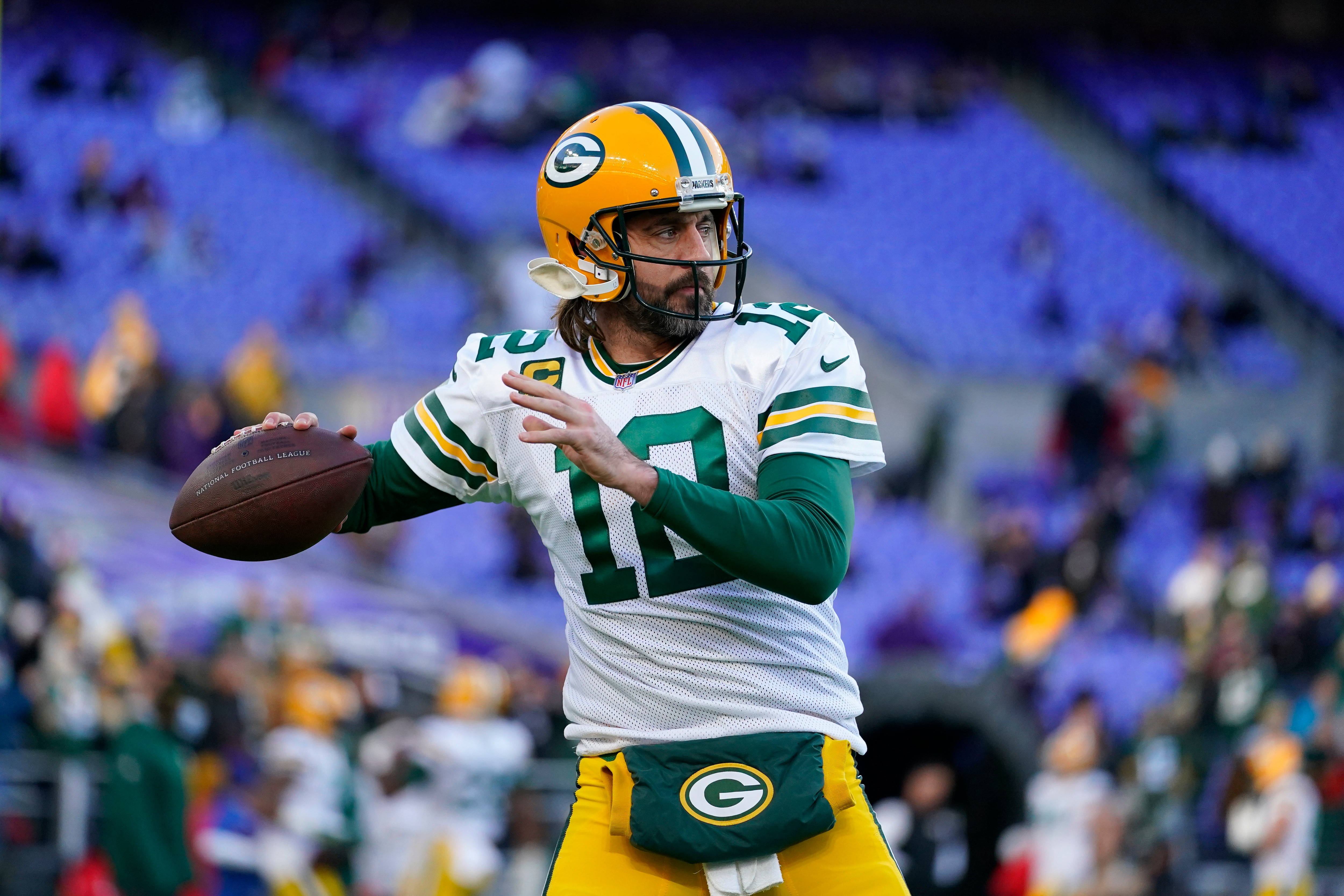 Green Bay Packers quarterback Aaron Rodgers warms up before an NFL football game against the Baltimore Ravens, Sunday, Dec. 19, 2021, in Baltimore. (AP Photo/Julio Cortez)