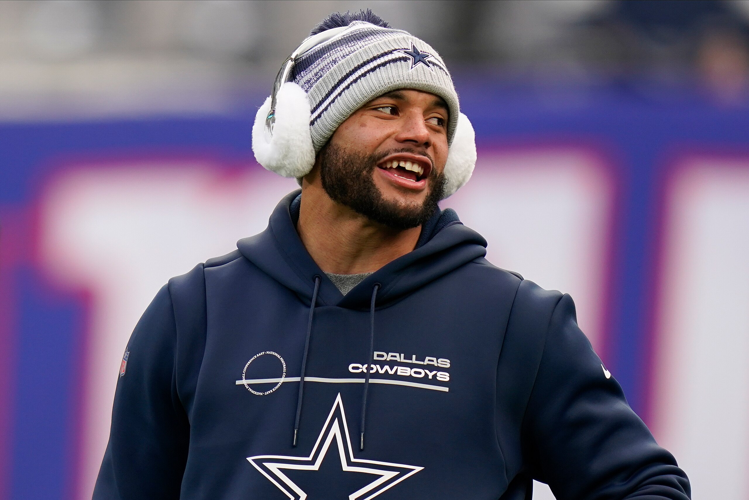 Dallas Cowboys quarterback Dak Prescott prepares to play against the New York Giants in an NFL football game, Sunday, Dec. 19, 2021, in East Rutherford, N.J. (AP Photo/Seth Wenig)