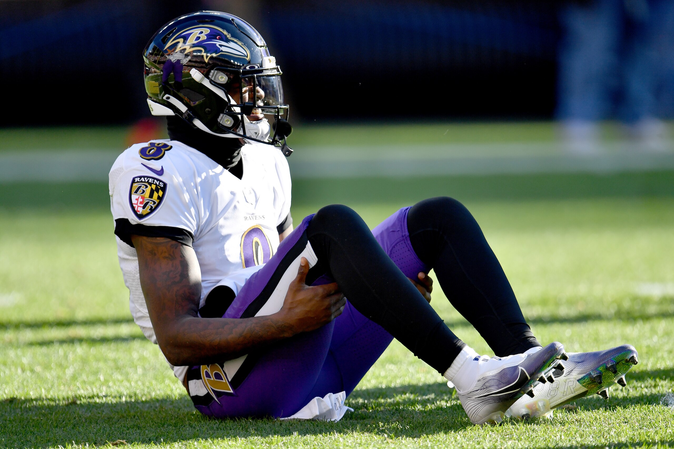 CLEVELAND, OHIO - DECEMBER 12: Lamar Jackson #8 of the Baltimore Ravens stays down on the field after suffering an injury in the first half against the Cleveland Browns at FirstEnergy Stadium on December 12, 2021 in Cleveland, Ohio. (Photo by Jason Miller/Getty Images)