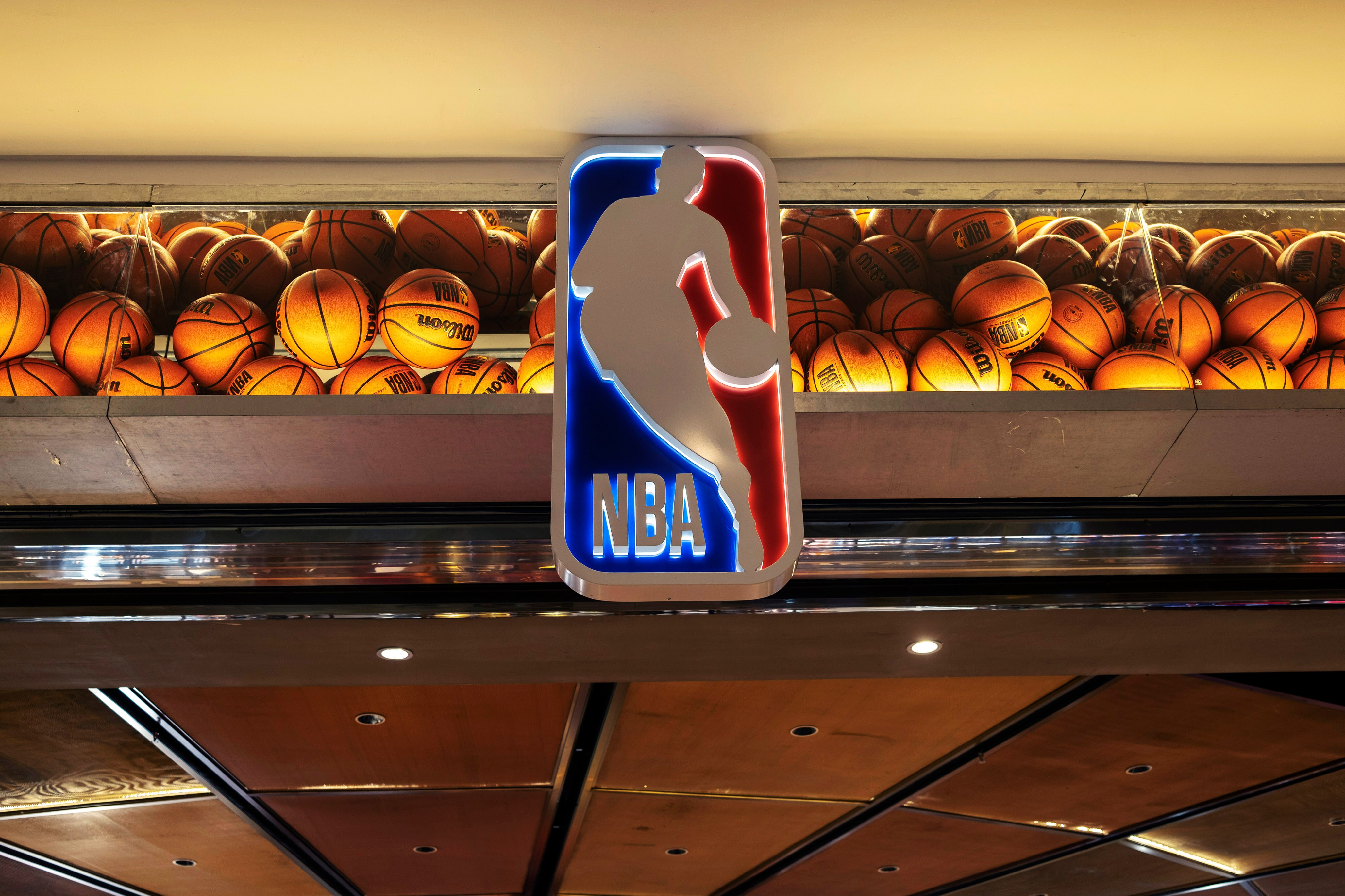 TIANJIN, CHINA - 2021/12/18: Logo of NBA and decorated basketballs of an NBA flagship store.  The American Professional Basketball League (NBA), has become the most popular sports league in China, and opened many stores in China's shopping centers. (Photo by Zhang Peng/LightRocket via Getty Images)