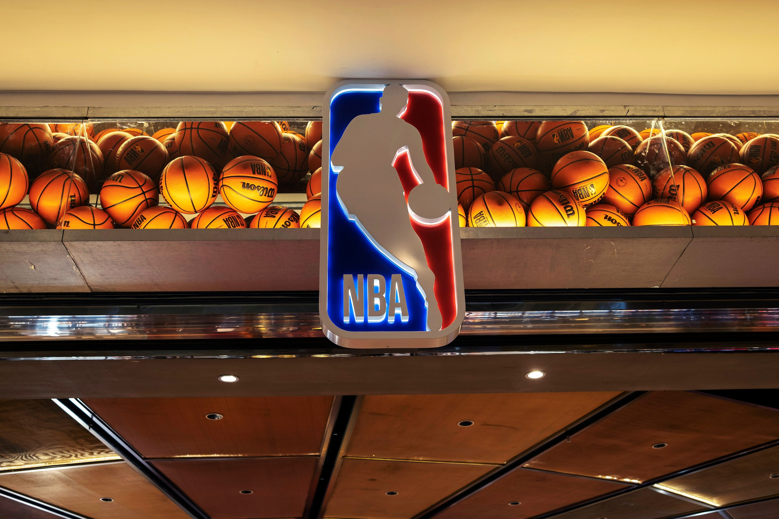 TIANJIN, CHINA - 2021/12/18: Logo of NBA and decorated basketballs of an NBA flagship store.  The American Professional Basketball League (NBA), has become the most popular sports league in China, and opened many stores in China's shopping centers. (Photo by Zhang Peng/LightRocket via Getty Images)
