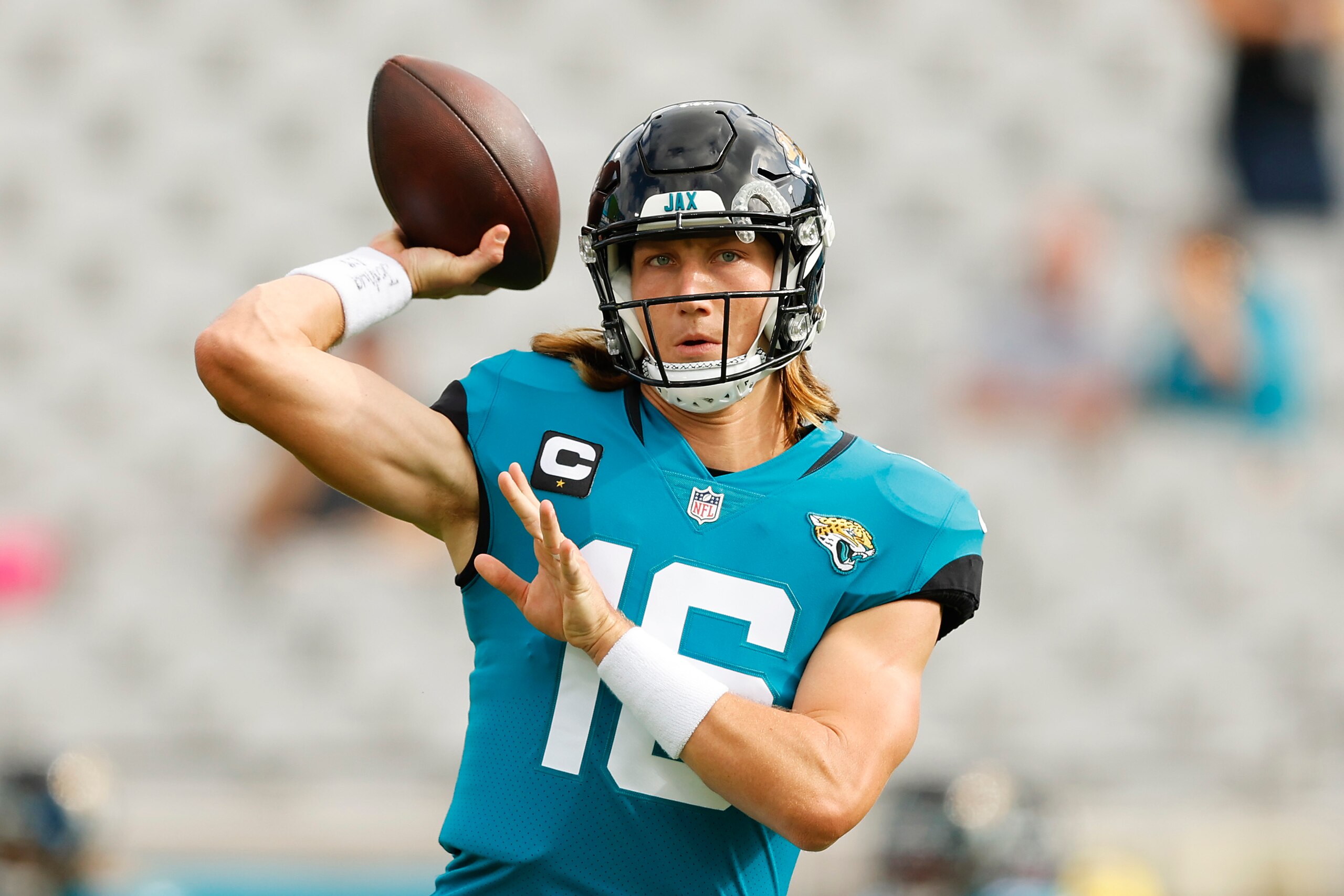 JACKSONVILLE, FLORIDA - DECEMBER 19: Trevor Lawrence #16 of the Jacksonville Jaguars throws the ball during pregame warm-ups before the game against the Houston Texans at TIAA Bank Field on December 19, 2021 in Jacksonville, Florida. (Photo by Michael Reaves/Getty Images)