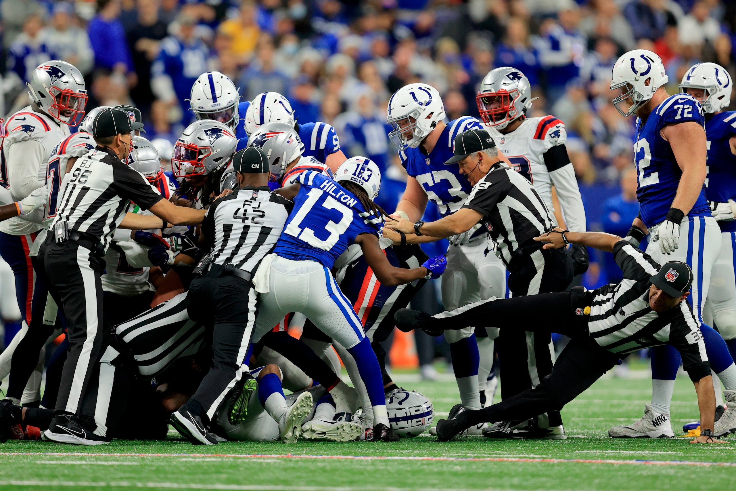 Indianapolis Colts wide receiver T.Y. Hilton (13) gets in the mix as officials try to break up a scuffle during the second half of an NFL football game between the Indianapolis Colts and the New England Patriots Saturday, Dec. 18, 2021, in Indianapolis. (AP Photo/Aaron Doster)