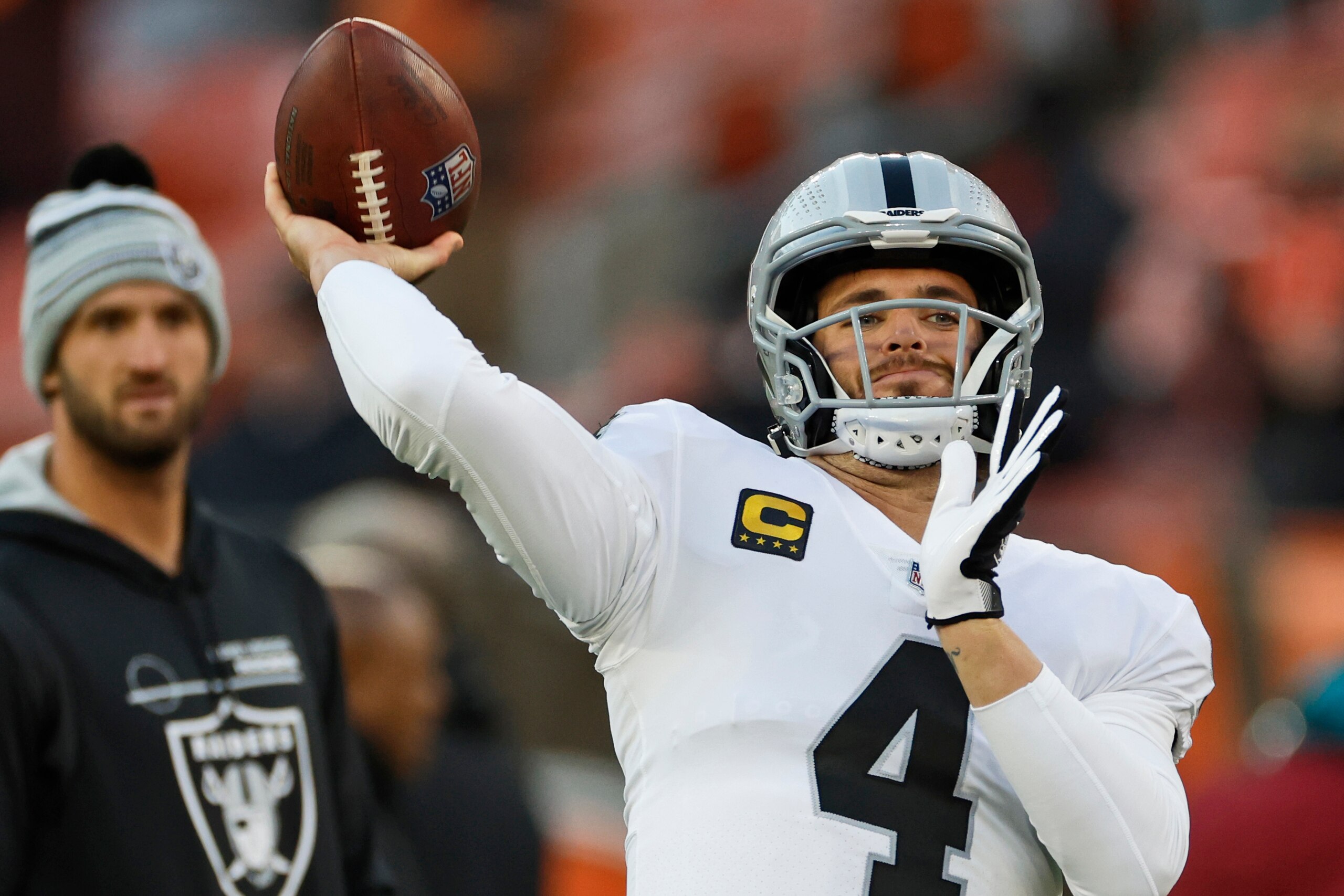 Las Vegas Raiders quarterback Derek Carr warms-up before an NFL football game against the Cleveland Browns, Monday, Dec. 20, 2021, in Cleveland. (AP Photo/Ron Schwane)