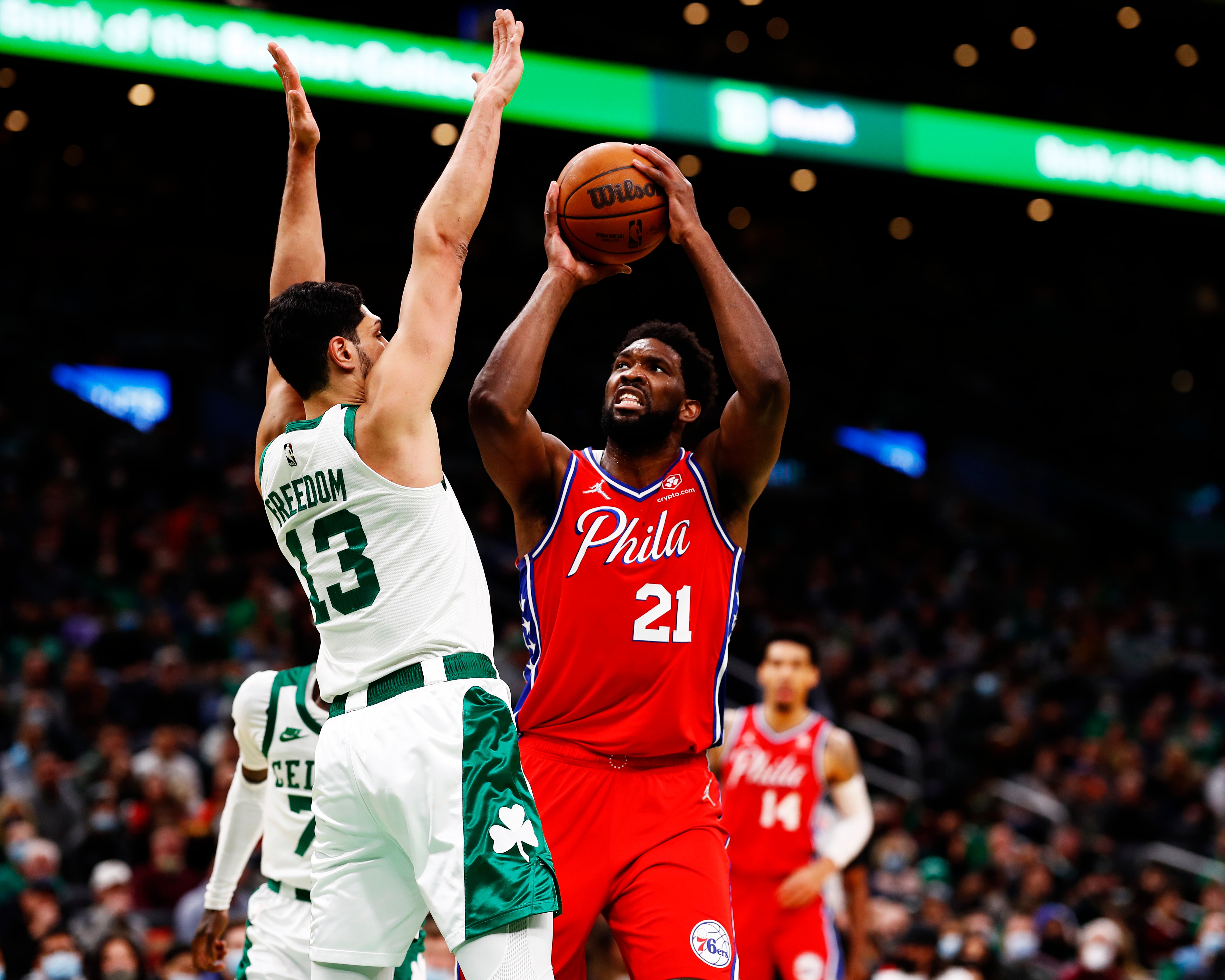 BOSTON, MASSACHUSETTS - DECEMBER 20: Joel Embiid #21 of the Philadelphia 76ers drives to the basket on Enes Freedom #13 of the Boston Celtics during the first quarter of the game against the Boston Celtics at TD Garden on December 20, 2021 in Boston, Massachusetts.NOTE TO USER: User expressly acknowledges and agrees that, by downloading and or using this photograph, User is consenting to the terms and conditions of the Getty Images License Agreement.  (Photo by Omar Rawlings/Getty Images)