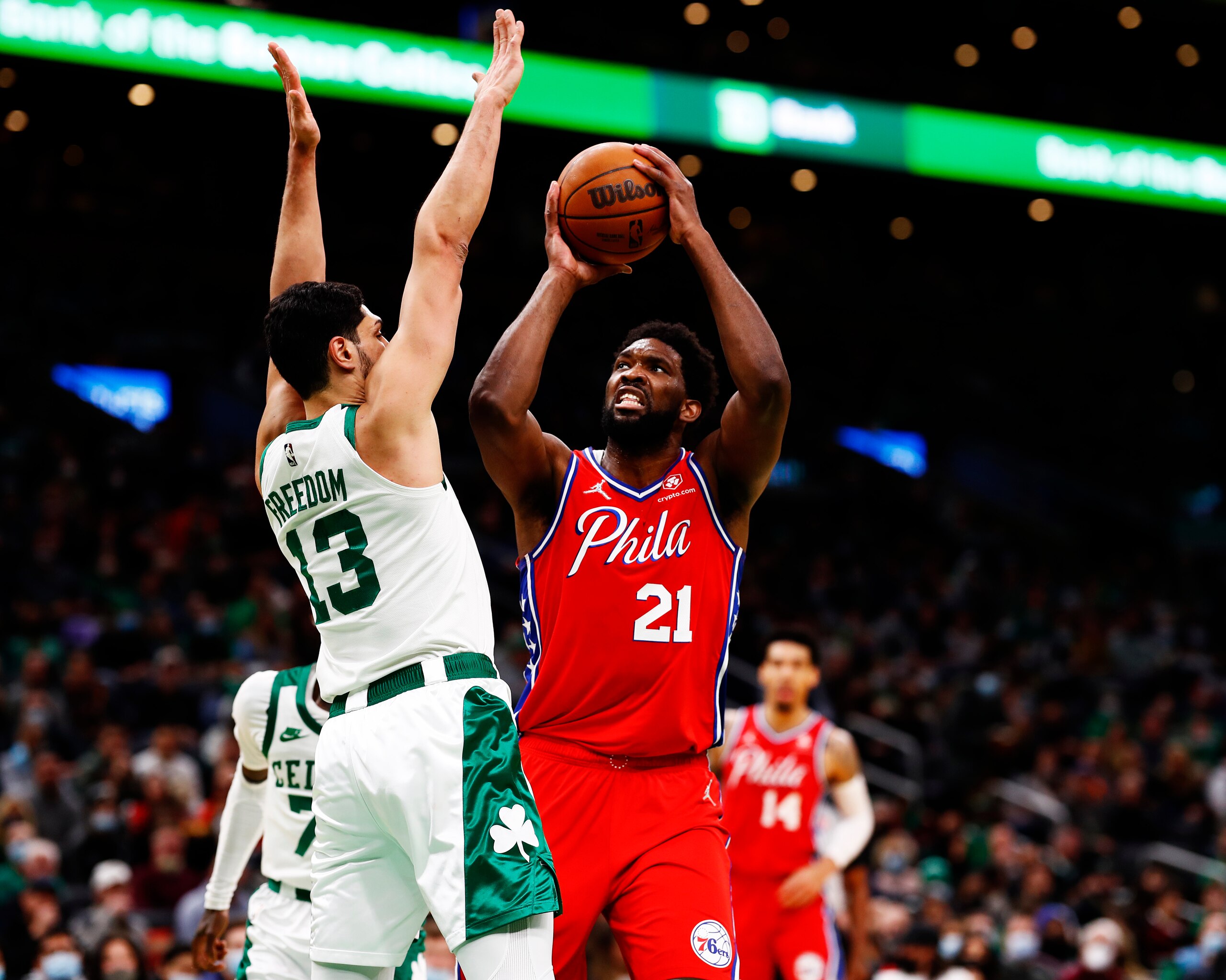 BOSTON, MASSACHUSETTS - DECEMBER 20: Joel Embiid #21 of the Philadelphia 76ers drives to the basket on Enes Freedom #13 of the Boston Celtics during the first quarter of the game against the Boston Celtics at TD Garden on December 20, 2021 in Boston, Massachusetts.NOTE TO USER: User expressly acknowledges and agrees that, by downloading and or using this photograph, User is consenting to the terms and conditions of the Getty Images License Agreement.  (Photo by Omar Rawlings/Getty Images)