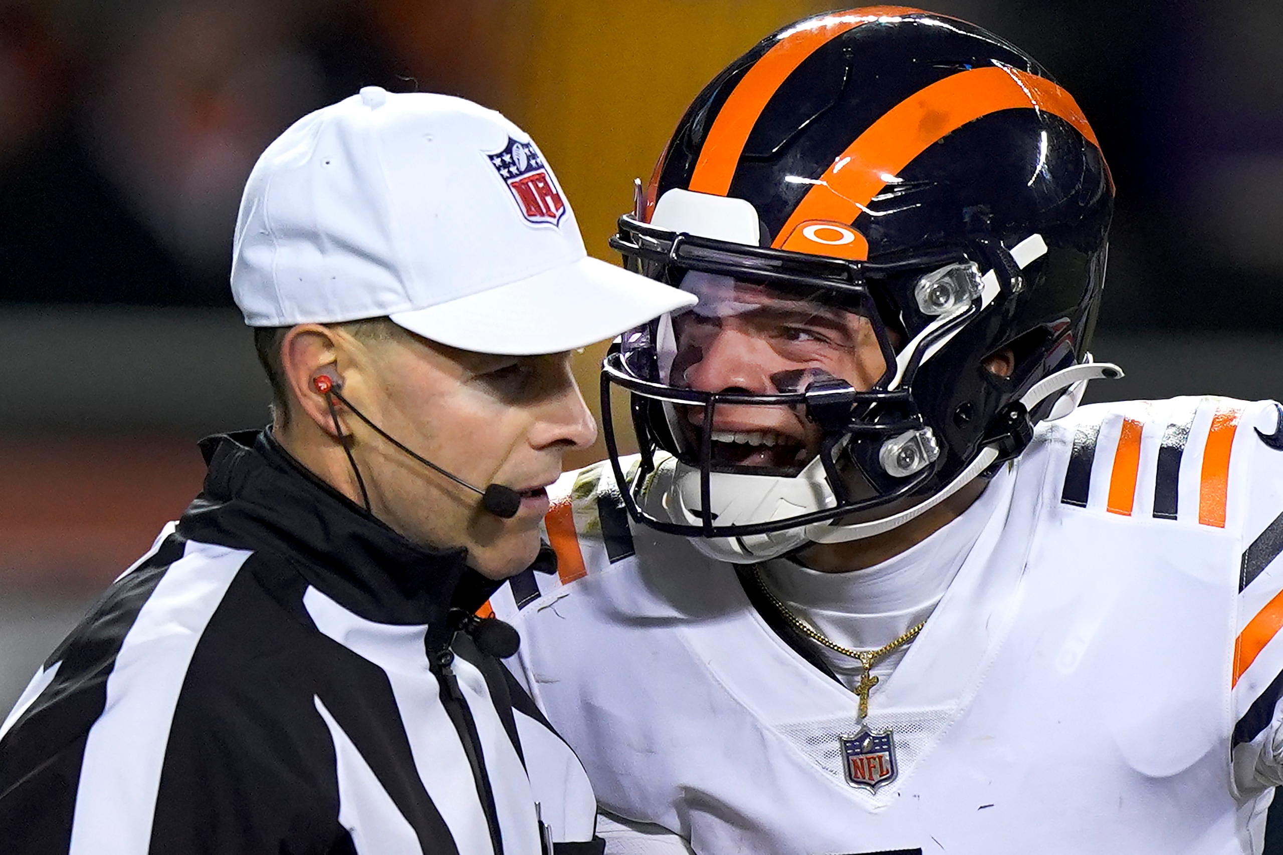 Chicago Bears quarterback Justin Fields, right, yells at referee Scott Novak after Fields was tackled hard into the ground by Minnesota Vikings defensive tackle James Lynch during the second half of an NFL football game Monday, Dec. 20, 2021, in Chicago. (AP Photo/Nam Y. Huh)