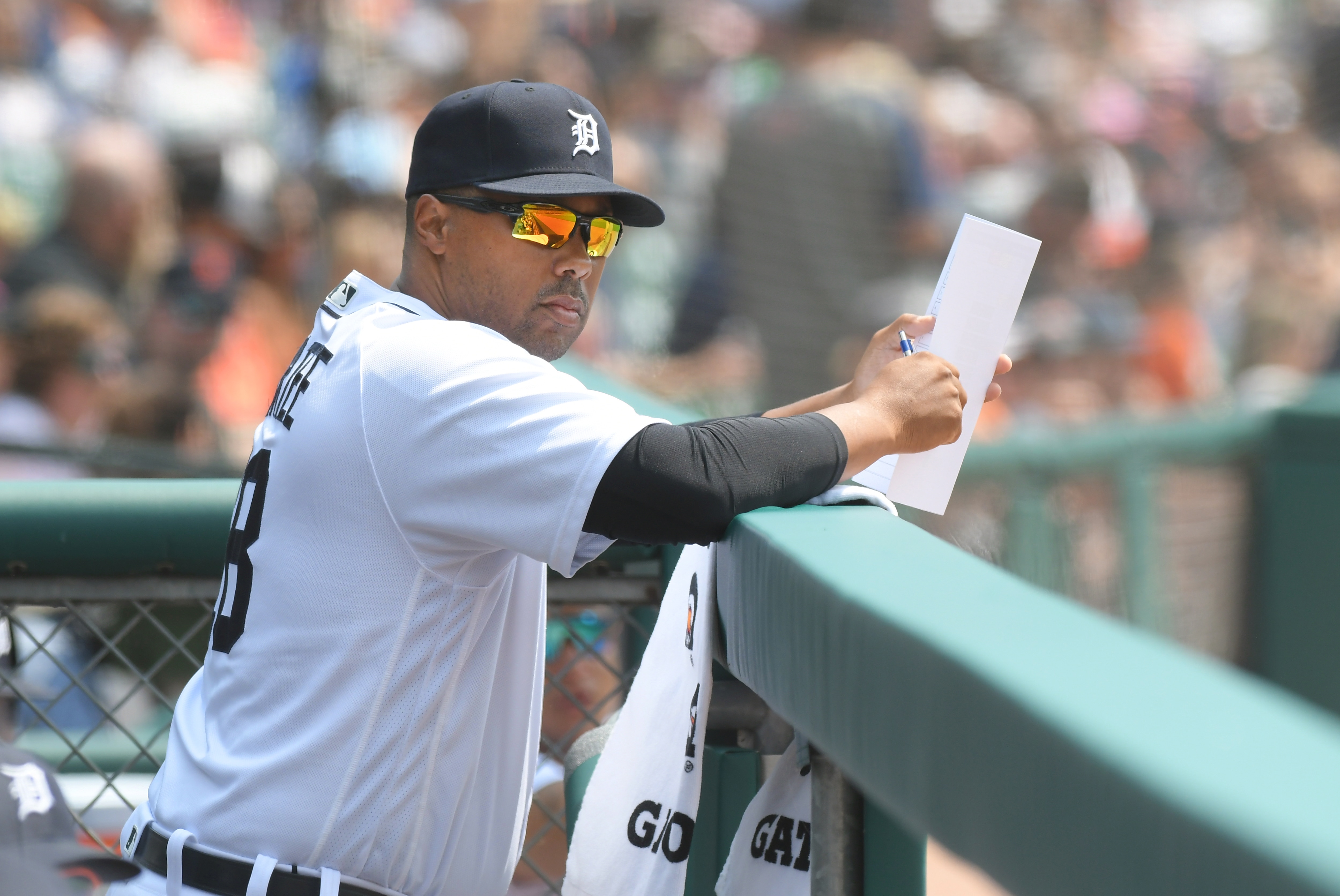 DETROIT, MI - AUGUST 01:  First base coach Kimera Bartee #18 of the Detroit Tigers looks on from the dugout during the game against the Baltimore Orioles at Comerica Park on August 1, 2021 in Detroit, Michigan. The Tigers defeated the Orioles 6-2.  (Photo by Mark Cunningham/MLB Photos via Getty Images)