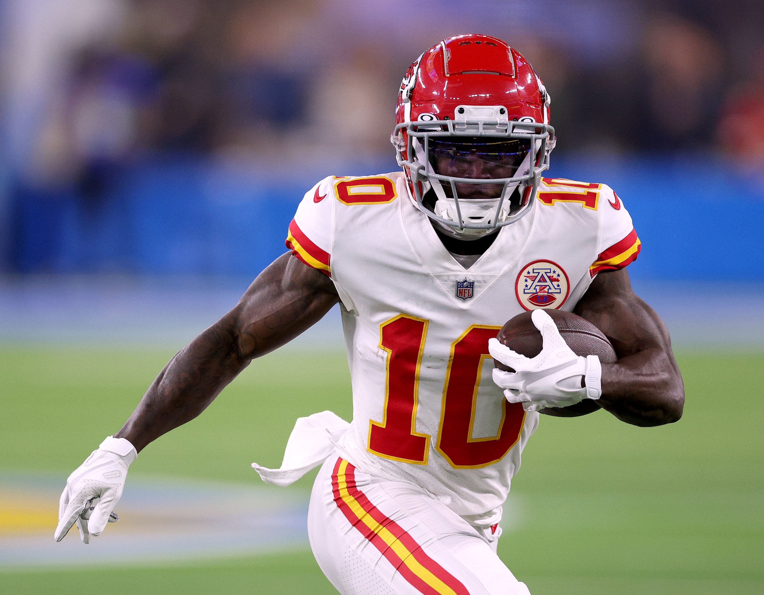 INGLEWOOD, CALIFORNIA - DECEMBER 16: Tyreek Hill #10 of the Kansas City Chiefs runs after his catch during a 34-28 win over the Los Angeles Chargers at SoFi Stadium on December 16, 2021 in Inglewood, California. (Photo by Harry How/Getty Images)