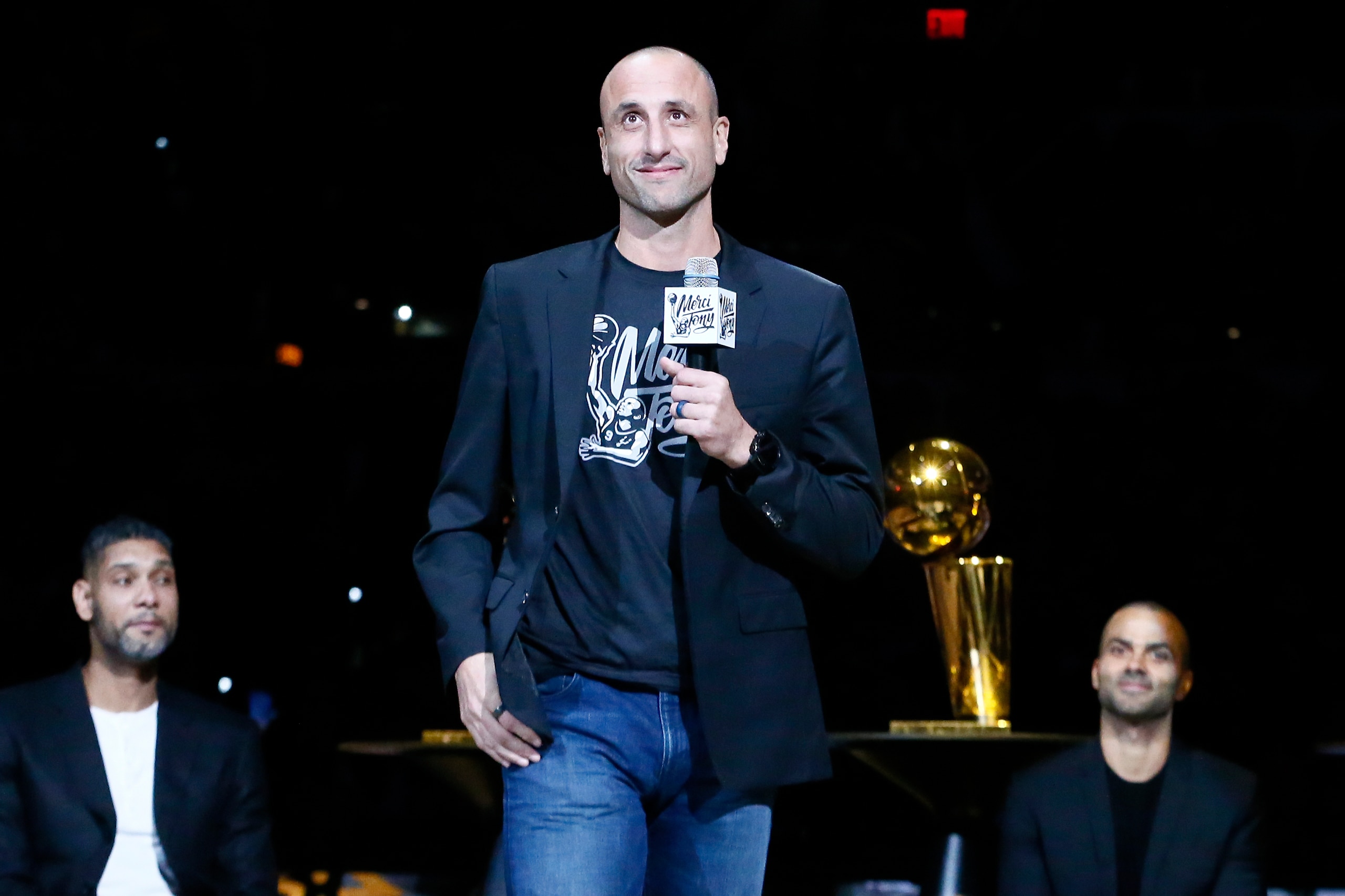 SAN ANTONIO, TX - NOVEMBER 11: Former NBA player, Manu Ginobili, speaks during the Tony Parker jersey retirement ceremony prior to a game between the Memphis Grizzlies and the San Antonio Spurs on November 11, 2019 at the AT&T Center in San Antonio, Texas. NOTE TO USER: User expressly acknowledges and agrees that, by downloading and or using this photograph, user is consenting to the terms and conditions of the Getty Images License Agreement. Mandatory Copyright Notice: Copyright 2019 NBAE (Photos by Chris Elise/NBAE via Getty Images)