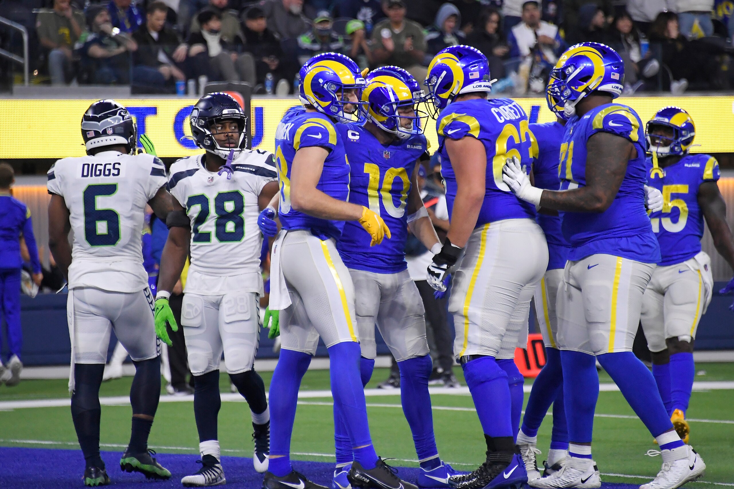 Los Angeles Rams wide receiver Cooper Kupp (10) celebrates his touchdown catch with teammates during the second half of an NFL football game against the Seattle Seahawks on Tuesday, Dec. 21, 2021, in Inglewood, Calif. (AP Photo/Kevork Djansezian)