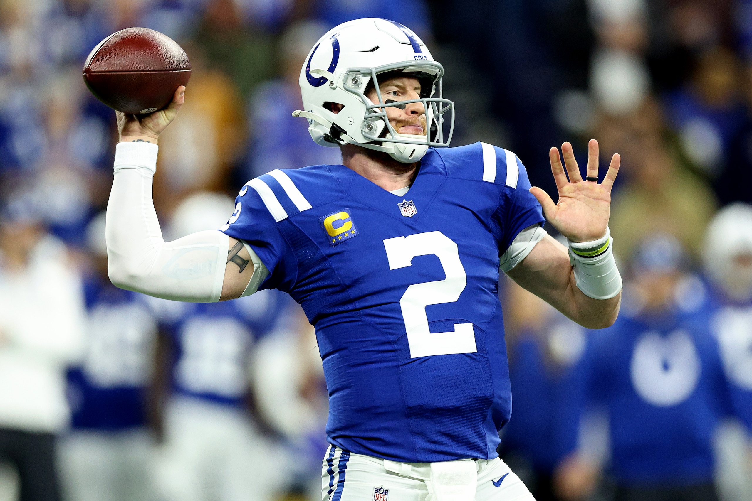 INDIANAPOLIS, INDIANA - DECEMBER 18: Carson Wentz #2 of the Indianapolis Colts looks to pass during the first quarter against the New England Patriots at Lucas Oil Stadium on December 18, 2021 in Indianapolis, Indiana. (Photo by Andy Lyons/Getty Images)
