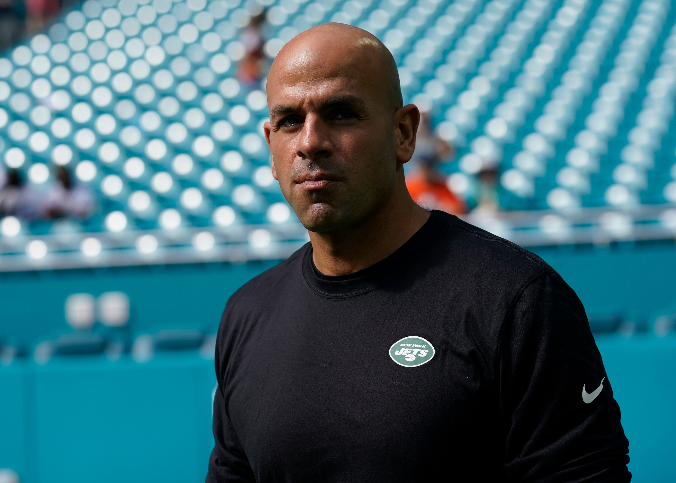 New York Jets head coach Robert Saleh watches the team warm up before an NFL football game against the Miami Dolphins, Sunday, Dec. 19, 2021, in Miami Gardens, Fla. (AP Photo/WIlfredo Lee)