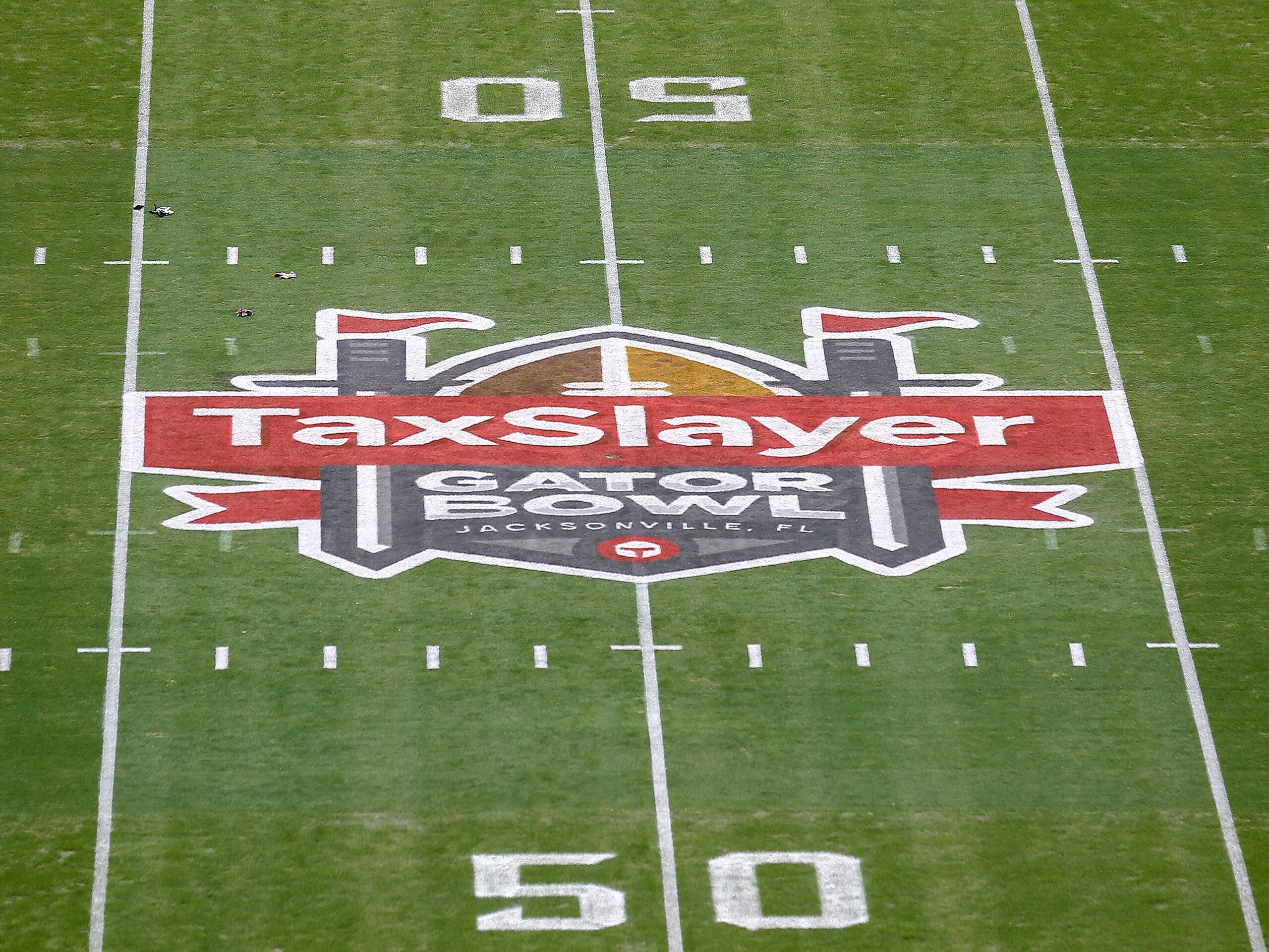 JACKSONVILLE, FL - JANUARY 2: A general view of the TaxSlayer Gator Bowl logo at mid-field before the North Carolina State Wolfpack plays against the University of Kentucky Wildcats at the 76th annual TaxSlayer Gator Bowl at TIAA Bank Field on January 2, 2021 in Jacksonvile, Florida.  (Photo by Don Juan Moore/Getty Images)
