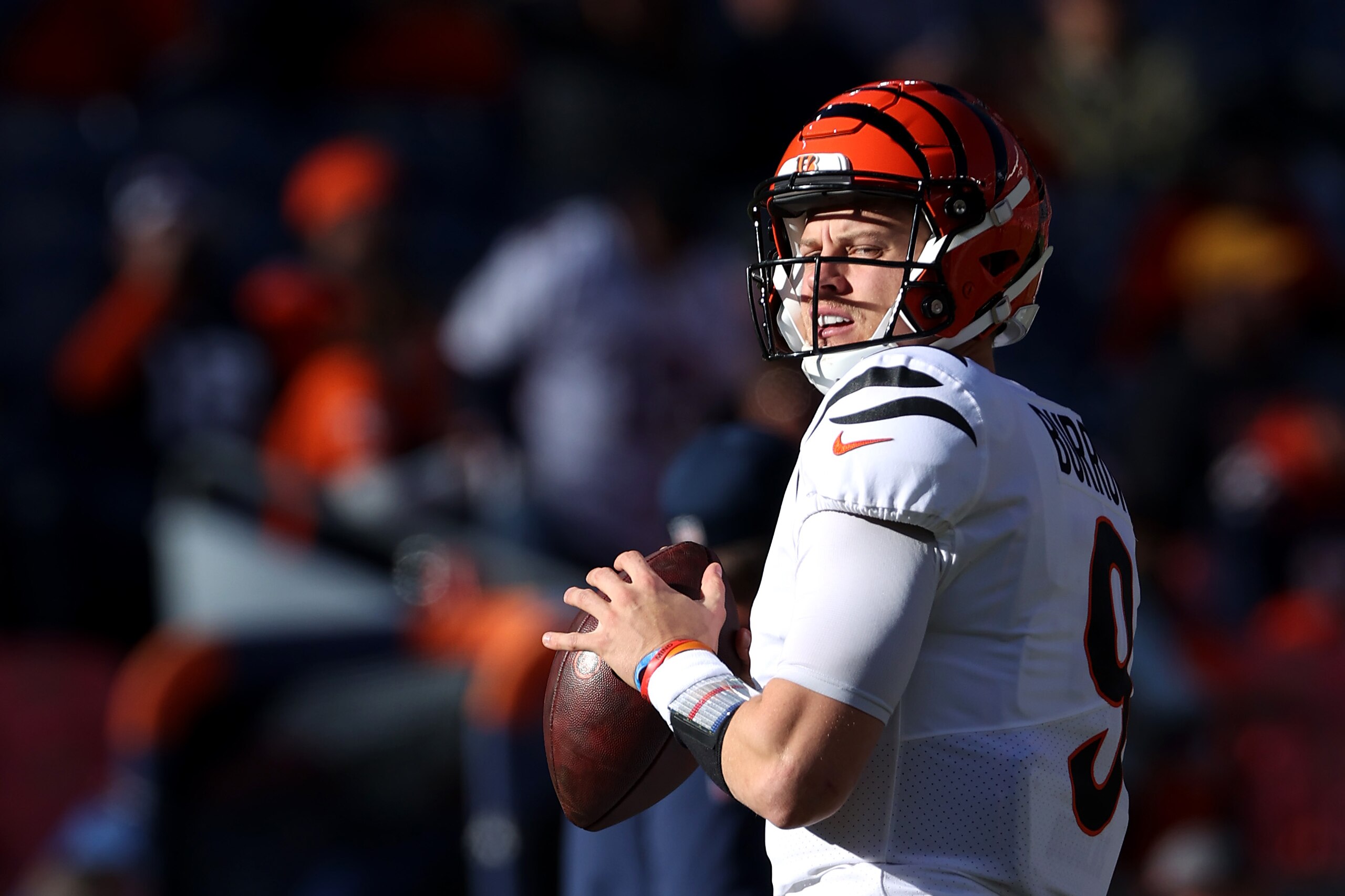 DENVER, COLORADO - DECEMBER 19: Joe Burrow #9 of the Cincinnati Bengals warms-up before the game against the Denver Broncos at Empower Field At Mile High on December 19, 2021 in Denver, Colorado. (Photo by Matthew Stockman/Getty Images)