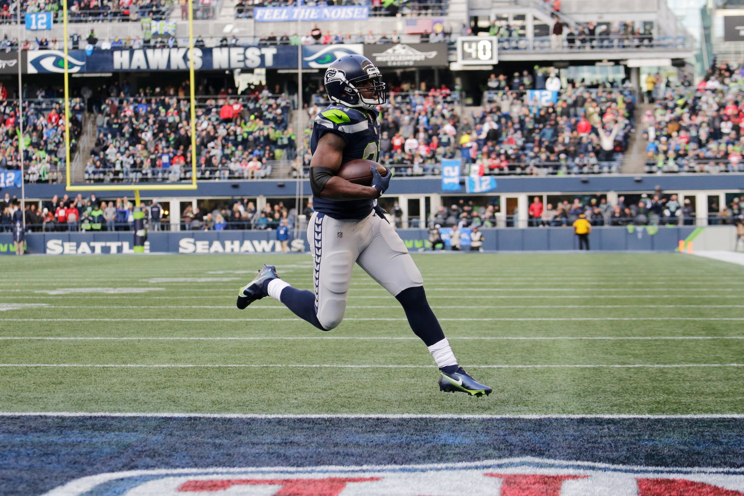 Seattle Seahawks running back Adrian Peterson scores a touchdown against the San Francisco 49ers during the first half of an NFL football game, Sunday, Dec. 5, 2021, in Seattle. (AP Photo/John Froschauer)