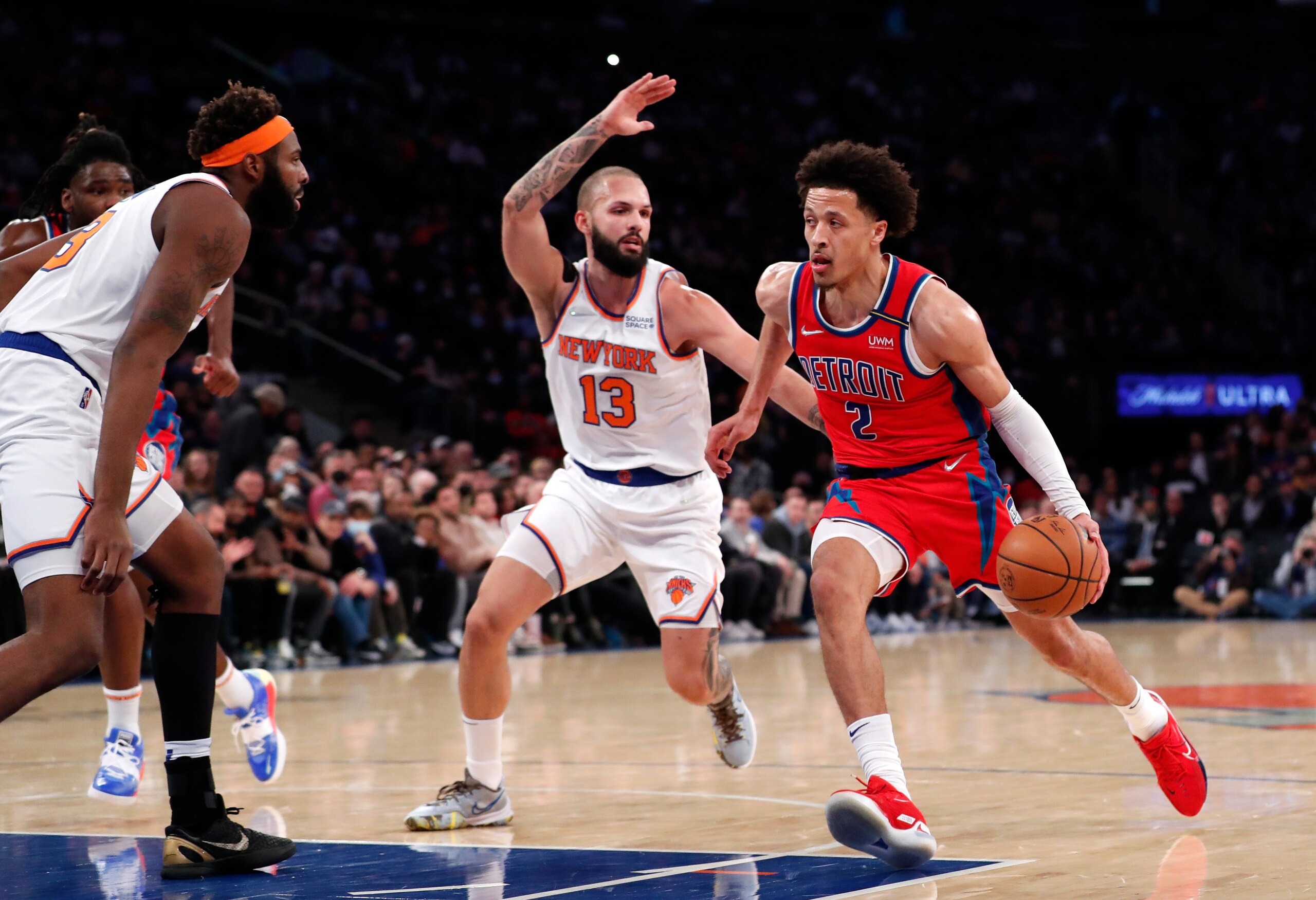 Detroit Pistons guard Cade Cunningham (2) drives to the basket against New York Knicks guard Evan Fournier (13) during the first half of an NBA basketball game,Tuesday, Dec. 21, 2021 in New York. (AP Photo/Noah K. Murray) Detroit Pistons guard Cade Cunningham (2) drives to the basket against New York Knicks guard Evan Fournier (13) during the first half of an NBA basketball game,Tuesday, Dec. 21, 2021 in New York. (AP Photo/Noah K. Murray)