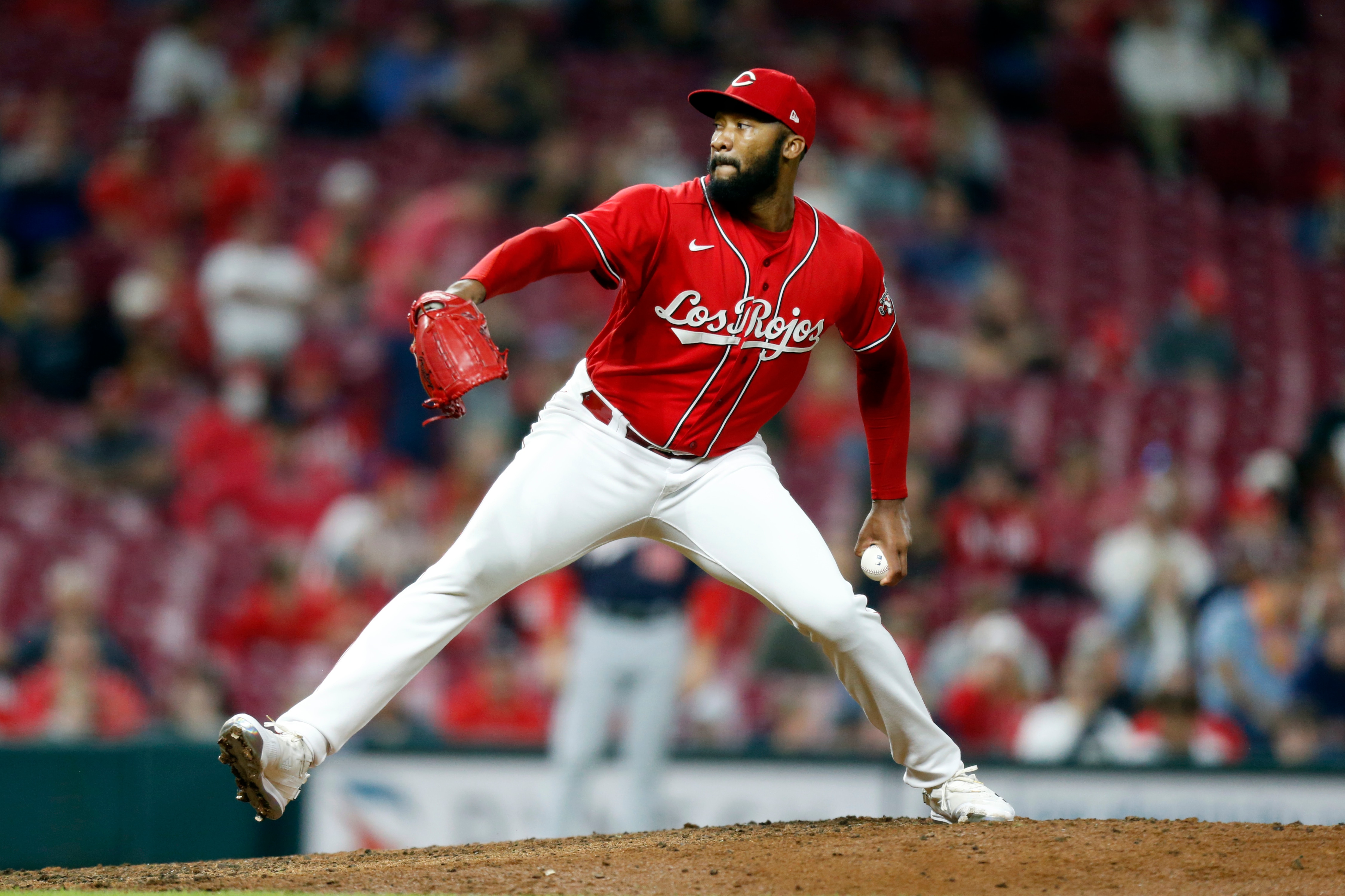 Cincinnati Reds pitcher Amir Garrett delivers a pitch during a baseball game against the Washington Nationals in Cincinnati Friday, Sept. 24, 2021. (AP Photo/Paul Vernon)