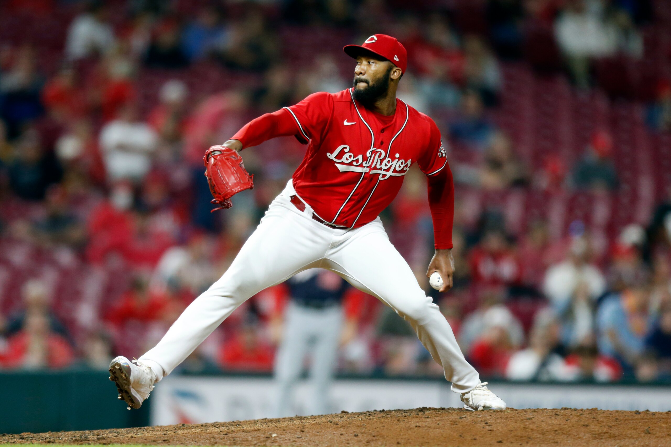 Cincinnati Reds pitcher Amir Garrett delivers a pitch during a baseball game against the Washington Nationals in Cincinnati Friday, Sept. 24, 2021. (AP Photo/Paul Vernon)