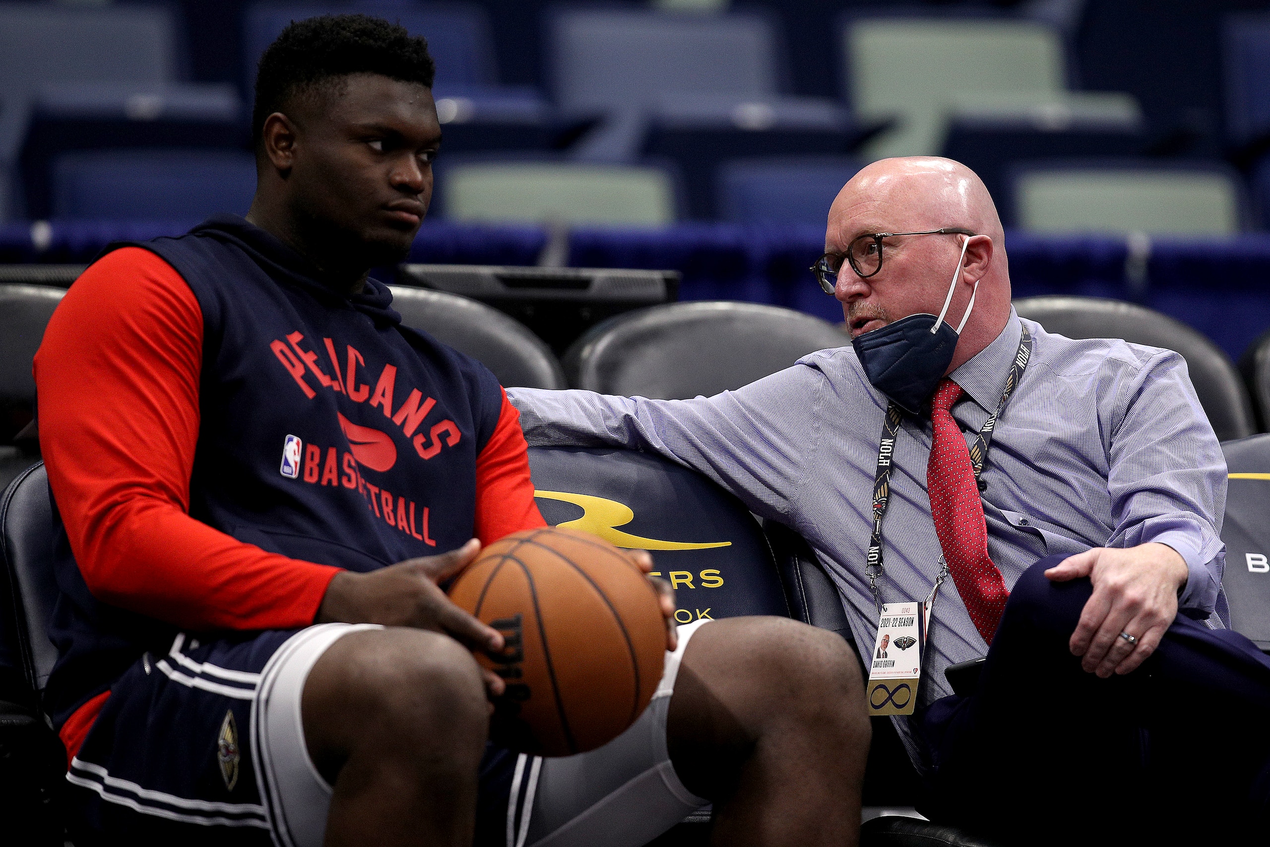 NEW ORLEANS, LOUISIANA - NOVEMBER 13: Zion Williamson #1 of the New Orleans Pelicans speaks with David Griffin executive vice president of basketball operations for the New Orleans Pelicans at Smoothie King Center on November 13, 2021 in New Orleans, Louisiana. NOTE TO USER: User expressly acknowledges and agrees that, by downloading and or using this photograph, User is consenting to the terms and conditions of the Getty Images License Agreement. (Photo by Sean Gardner/Getty Images)