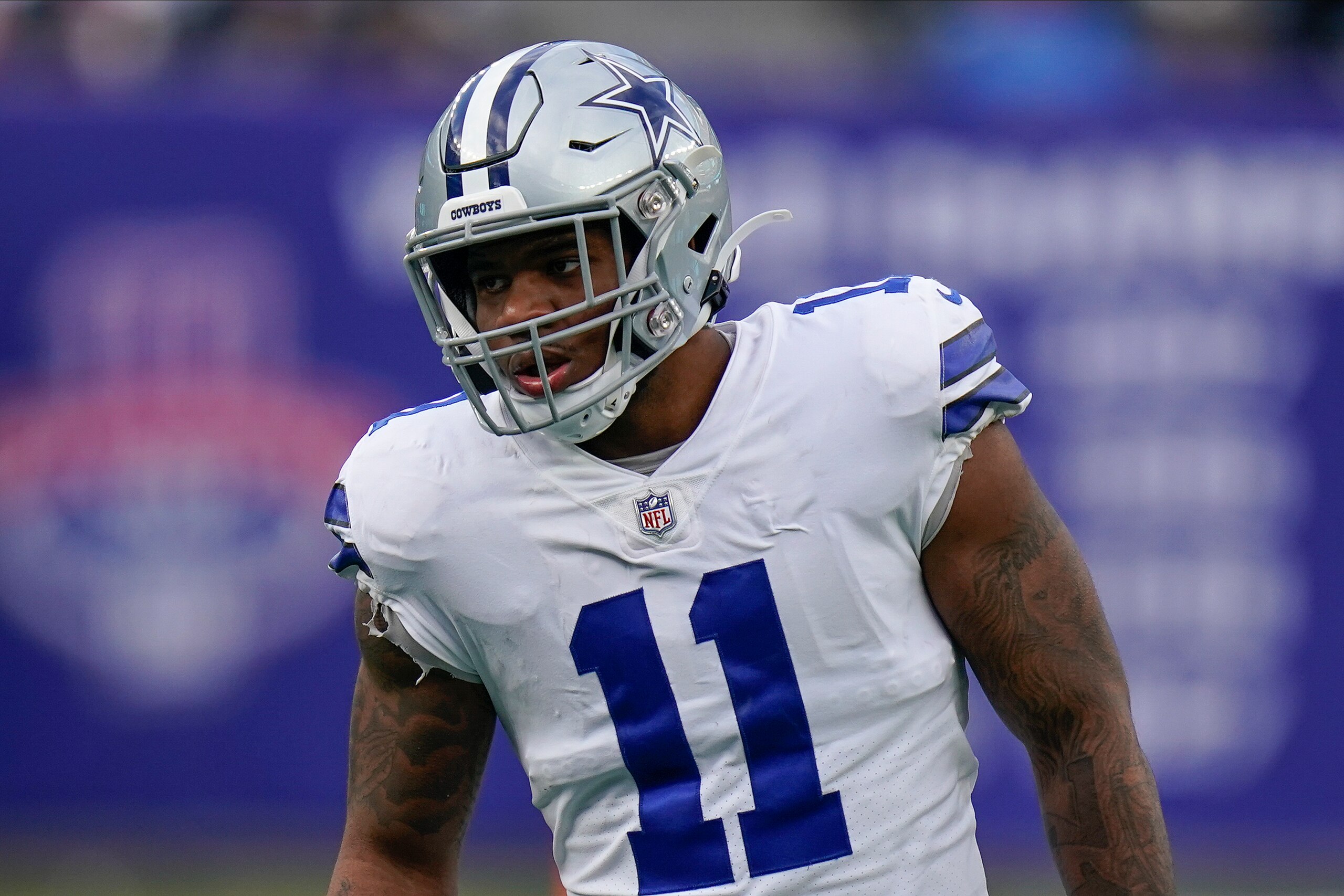 Dallas Cowboys outside linebacker Micah Parsons (11) stands on the field with teammates between plays against the New York Giants during the fourth quarter of an NFL football game, Sunday, Dec. 19, 2021, in East Rutherford, N.J. (AP Photo/Seth Wenig)