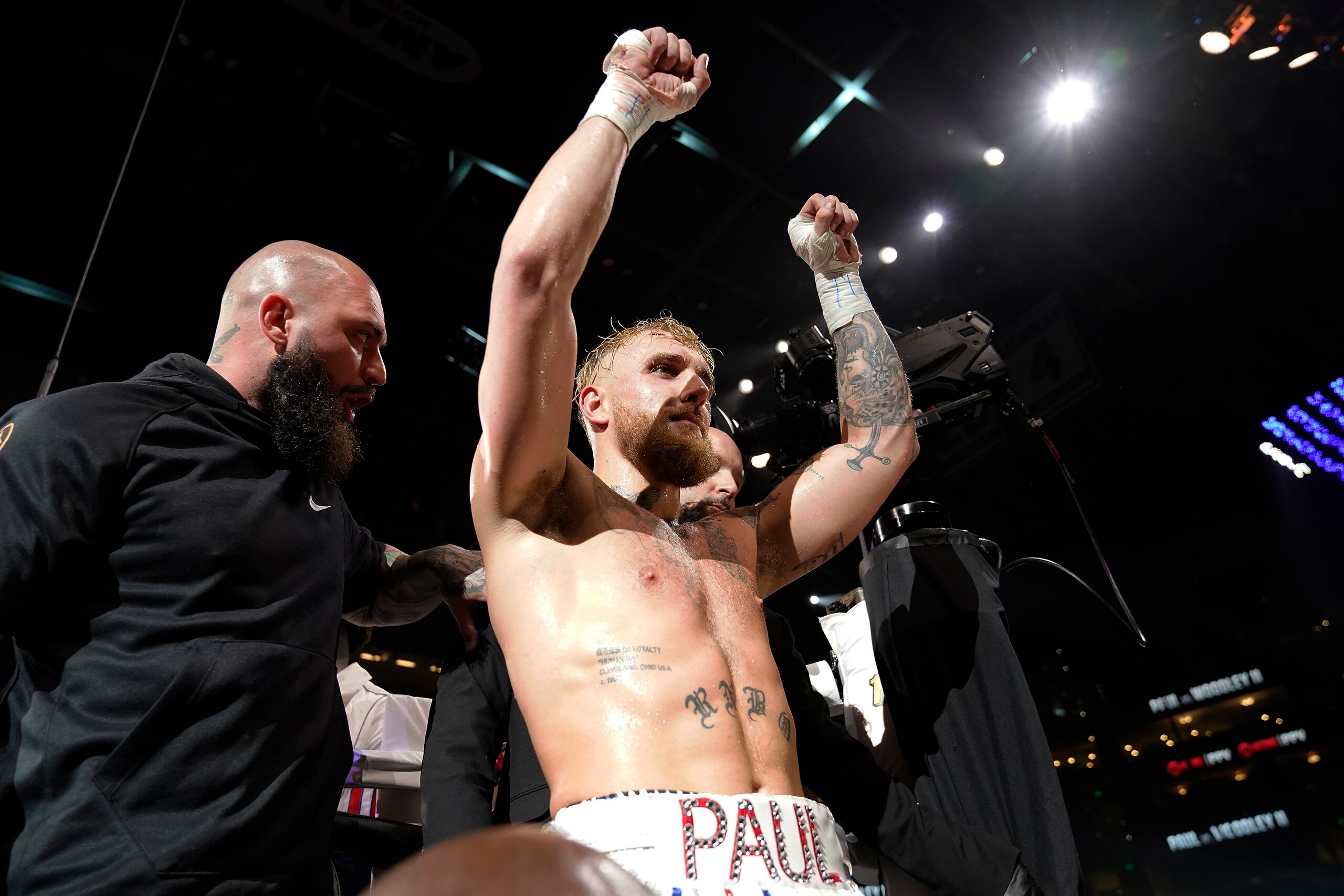 Jake Paul celebrates after knocking out Tyron Woodley during the sixth round of a Cruiserweight fight Sunday, Dec. 19, 2021, in Tampa, Fla. (AP Photo/Chris O'Meara)