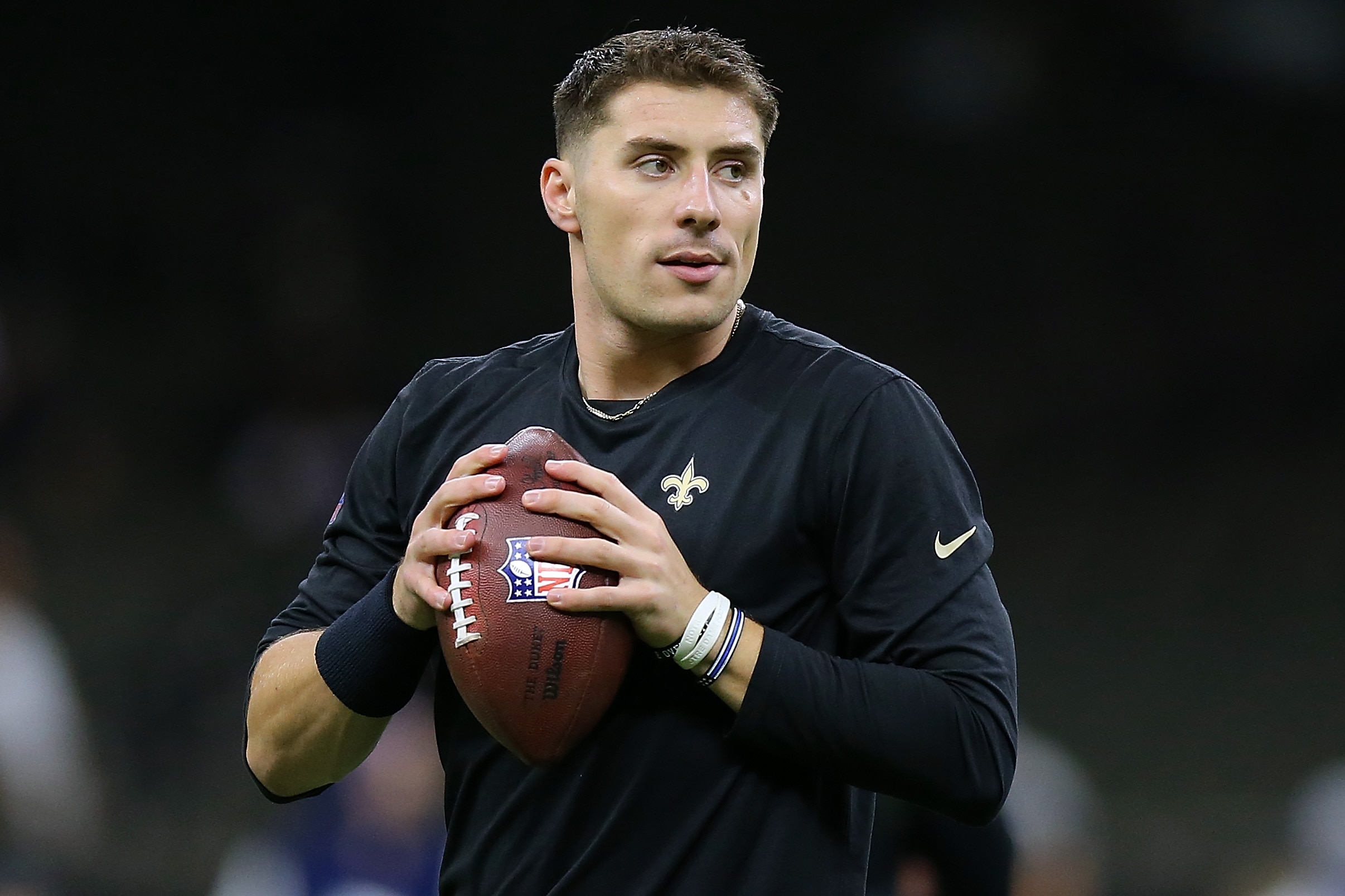 NEW ORLEANS, LOUISIANA - DECEMBER 02: Ian Book #16 of the New Orleans Saints warms up before a game against the Dallas Cowboys at the the Caesars Superdome on December 02, 2021 in New Orleans, Louisiana. (Photo by Jonathan Bachman/Getty Images) NEW ORLEANS, LOUISIANA - DECEMBER 02: Ian Book #16 of the New Orleans Saints warms up before a game against the Dallas Cowboys at the the Caesars Superdome on December 02, 2021 in New Orleans, Louisiana. (Photo by Jonathan Bachman/Getty Images)