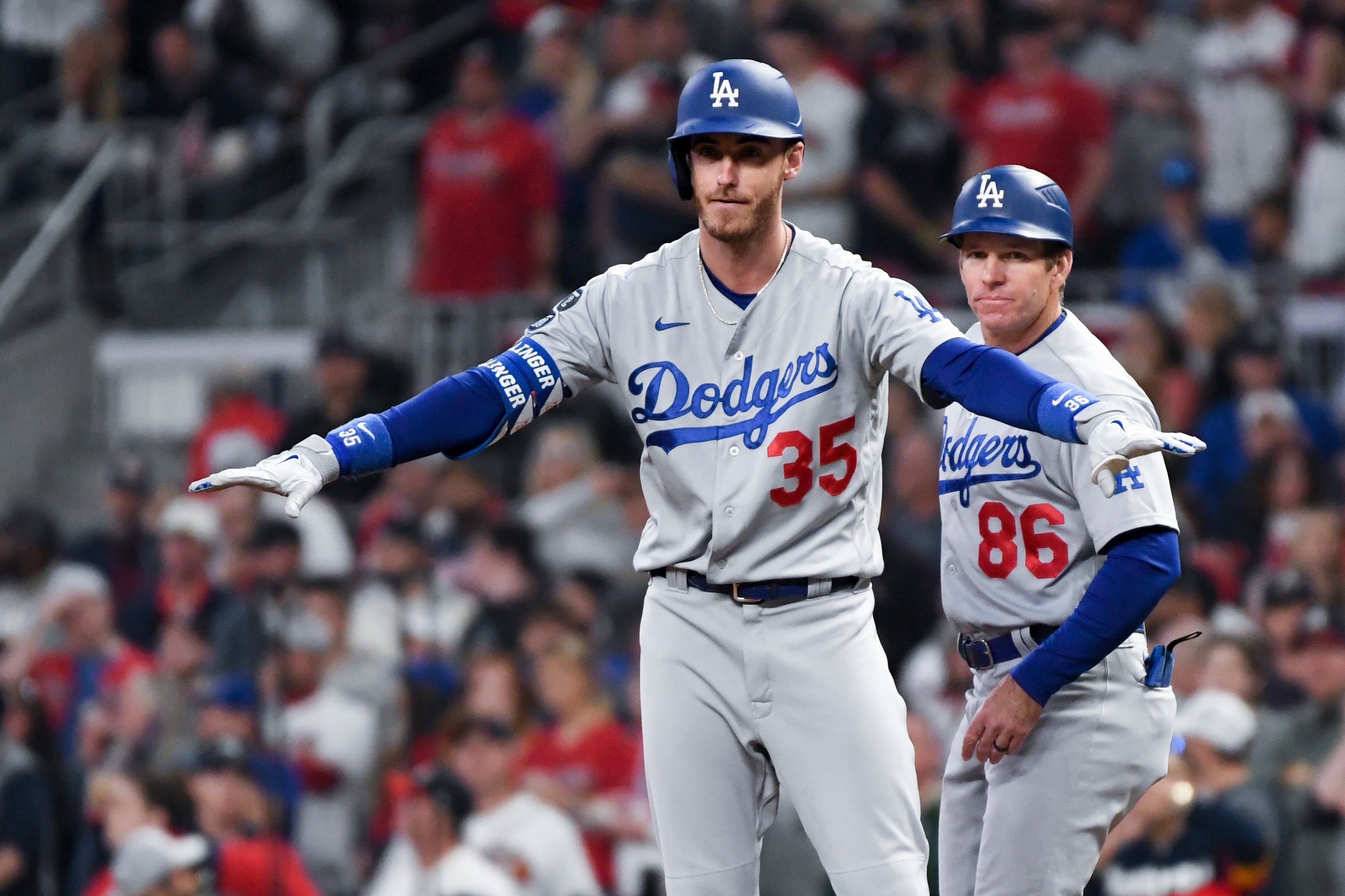 Atlanta, GA - October 23: Los Angeles Dodgers' Cody Bellinger celebrates at first base after an RBI single during the fourth inning in game six in the 2021 National League Championship Seriesagainst the Atlanta Braves at Truist Park on Saturday, Oct. 23, 2021 in Atlanta, GA. (Wally Skalij / Los Angeles Times via Getty Images)