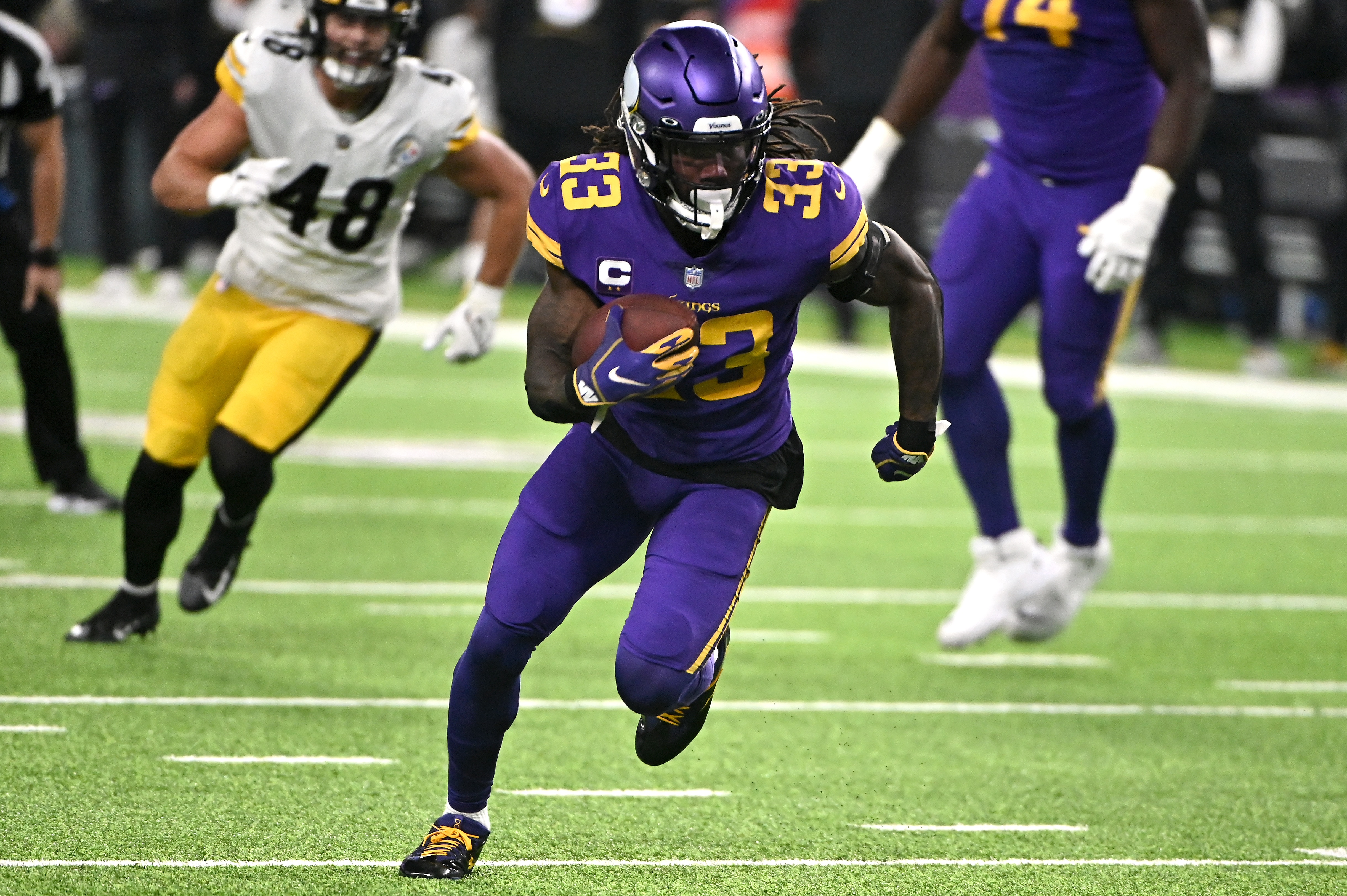 MINNEAPOLIS, MINNESOTA - DECEMBER 09: Dalvin Cook #33 of the Minnesota Vikings carries the ball in the second quarter of the game against the Pittsburgh Steelers at U.S. Bank Stadium on December 09, 2021 in Minneapolis, Minnesota. (Photo by Stephen Maturen/Getty Images)