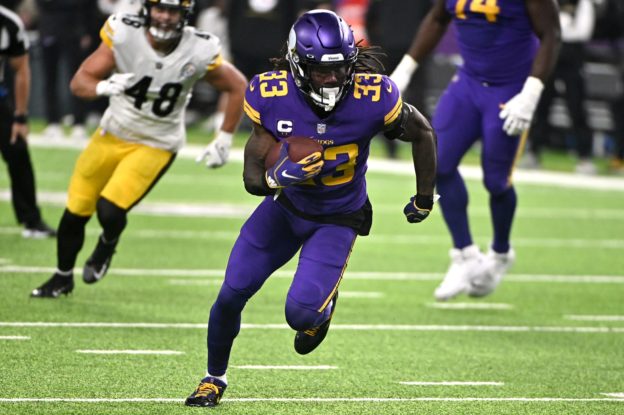 MINNEAPOLIS, MINNESOTA - DECEMBER 09: Dalvin Cook #33 of the Minnesota Vikings carries the ball in the second quarter of the game against the Pittsburgh Steelers at U.S. Bank Stadium on December 09, 2021 in Minneapolis, Minnesota. (Photo by Stephen Maturen/Getty Images)