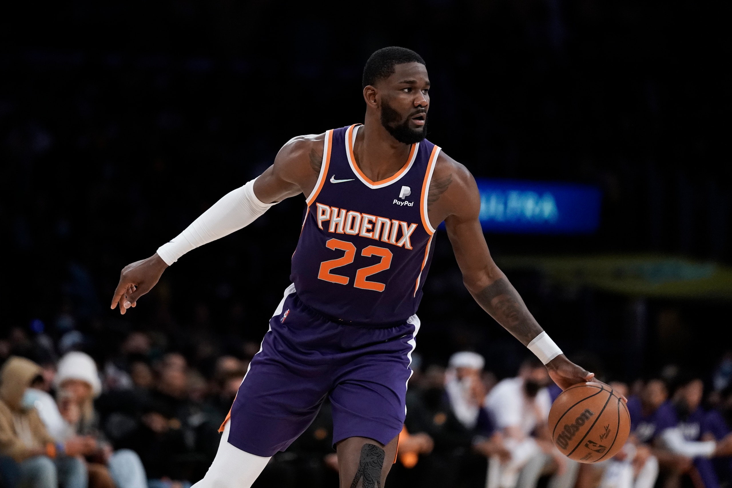 Phoenix Suns' Deandre Ayton dribbles the ball during first half of an NBA basketball game against the Los Angeles Lakers Tuesday, Dec. 21, 2021, in Los Angeles. (AP Photo/Jae C. Hong)