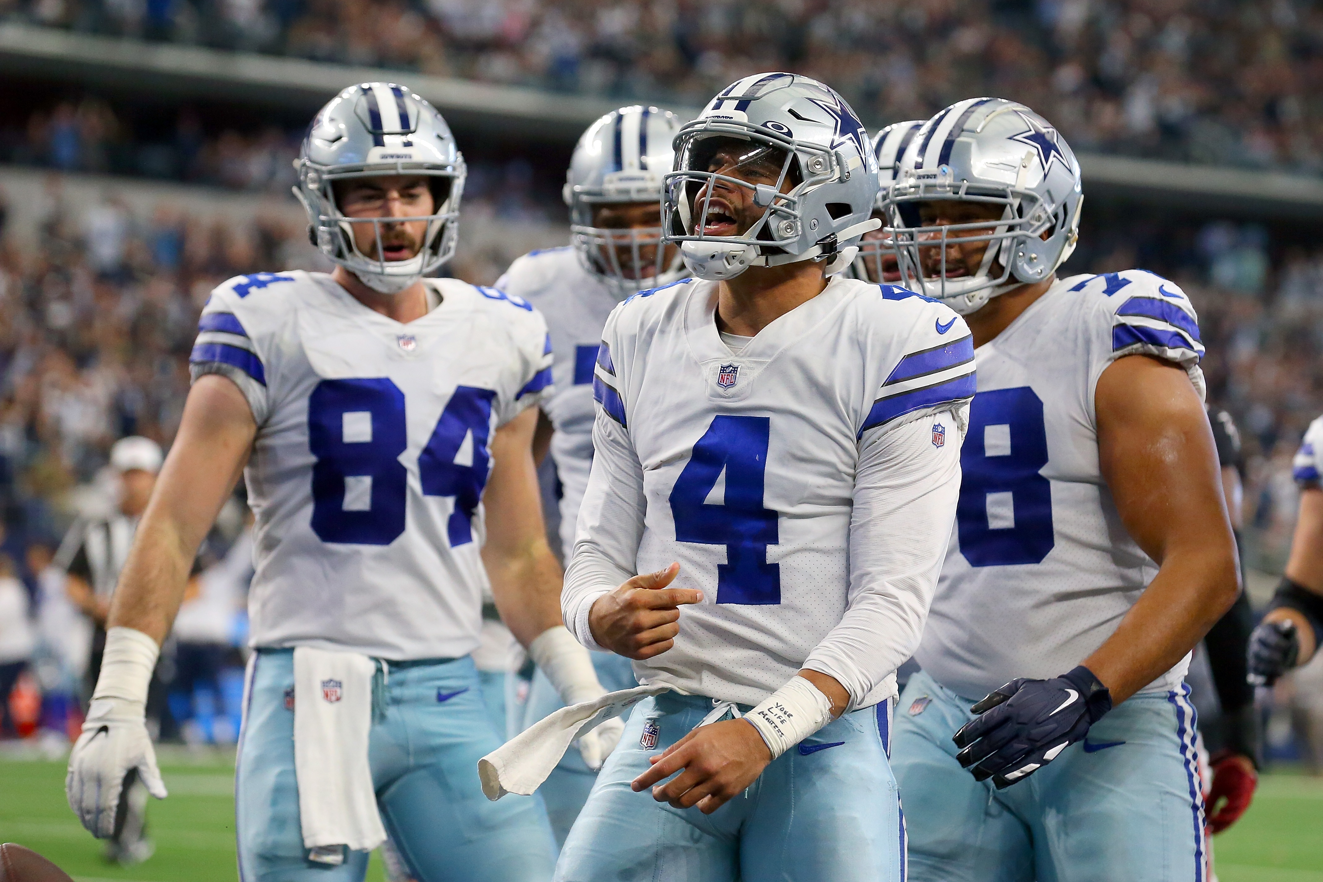 ARLINGTON, TEXAS - NOVEMBER 14: Dak Prescott #4 of the Dallas Cowboys celebrates a touchdown against the Atlanta Falcons at AT&T Stadium on November 14, 2021 in Arlington, Texas. (Photo by Richard Rodriguez/Getty Images)