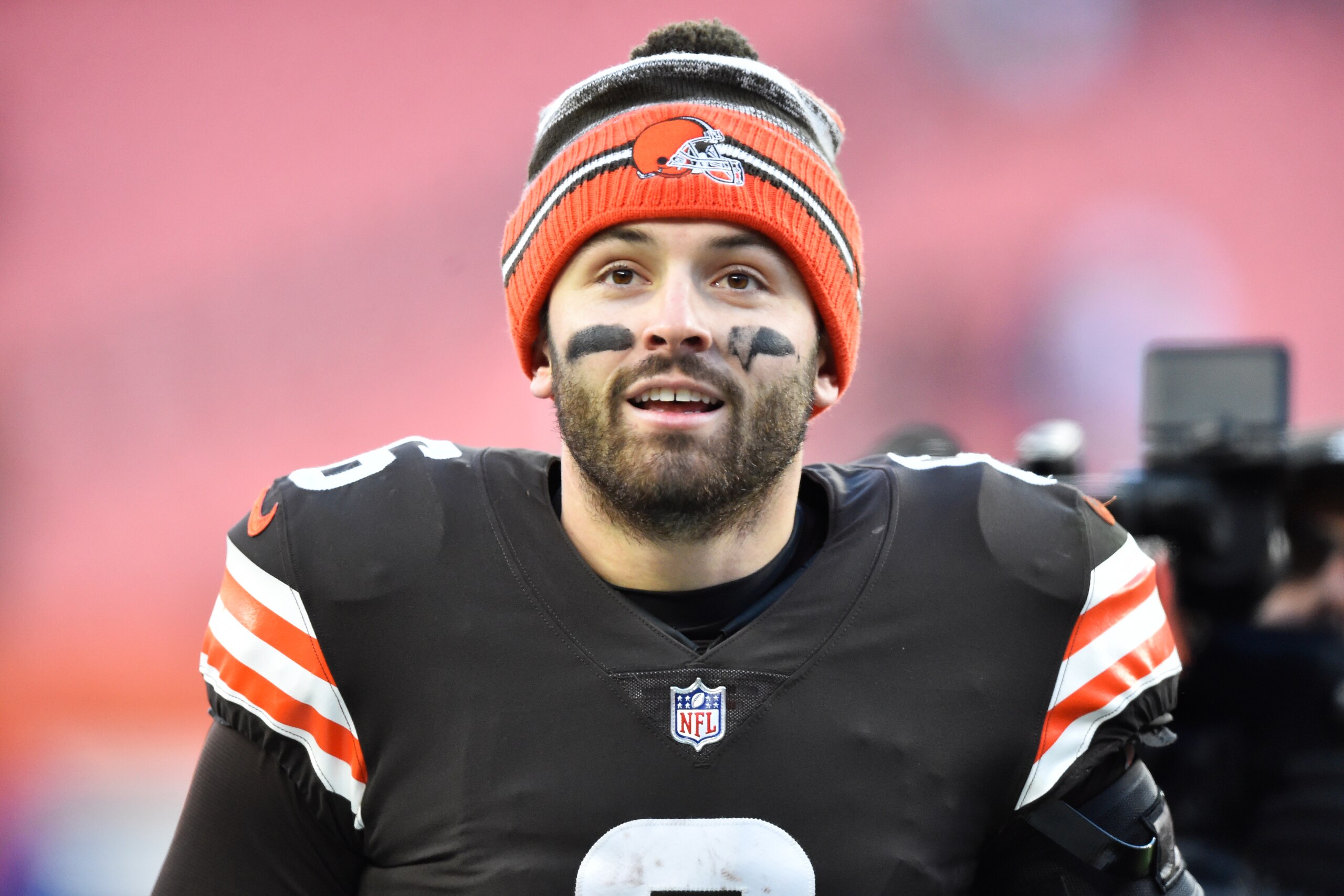 FILE - Cleveland Browns quarterback Baker Mayfield walks off the field after his team defeated the Baltimore Ravens in an NFL football game, Sunday, Dec. 12, 2021, in Cleveland.  Mayfield and coach Kevin Stefanski tested positive for COVID-19 on Wednesday, Dec. 15,  and will likely miss Saturday’s game against the Las Vegas Raiders as Cleveland deals with a widespread outbreak during its playoff pursuit.(AP Photo/David Richard, File)
