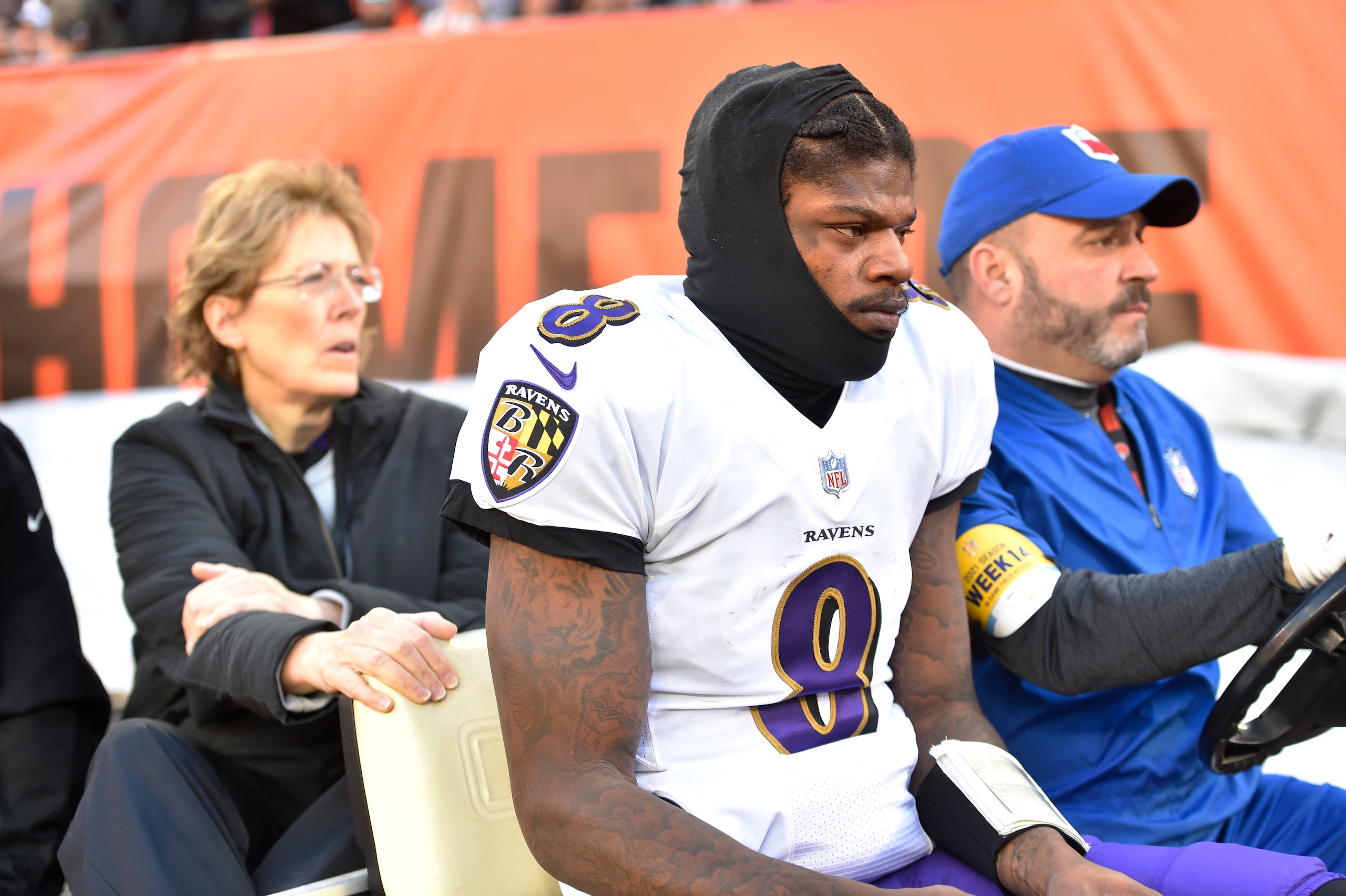 Baltimore Ravens quarterback Lamar Jackson (8) is carted off the field after an injury during the first half of an NFL football game against the Cleveland Browns, Sunday, Dec. 12, 2021, in Cleveland. (AP Photo/David Richard)