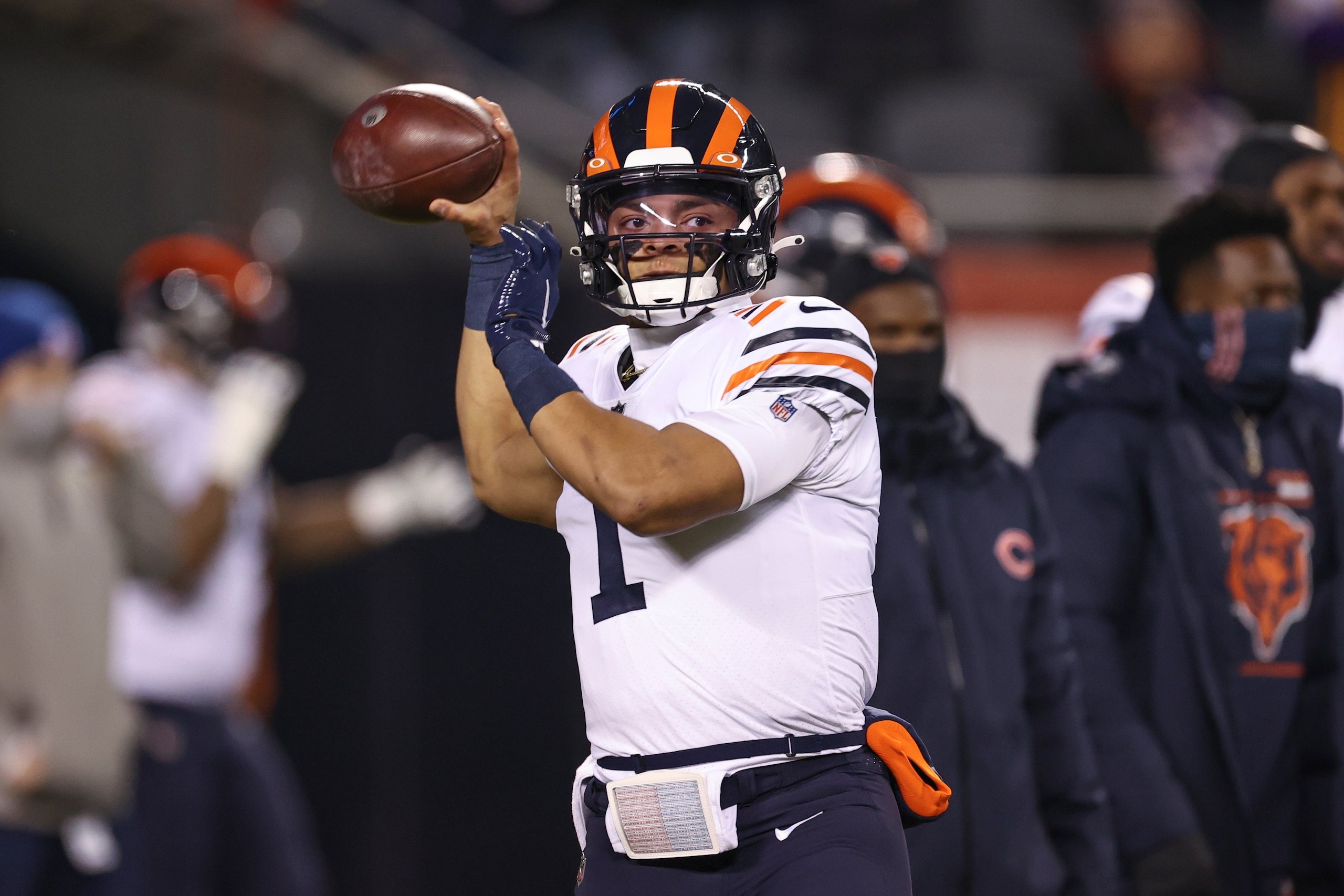Chicago Bears quarterback Justin Fields (1) warms up before an NFL football game against the Minnesota Vikings, Monday, Dec. 20, 2021, in Chicago. (AP Photo/Kamil Krzaczynski)
