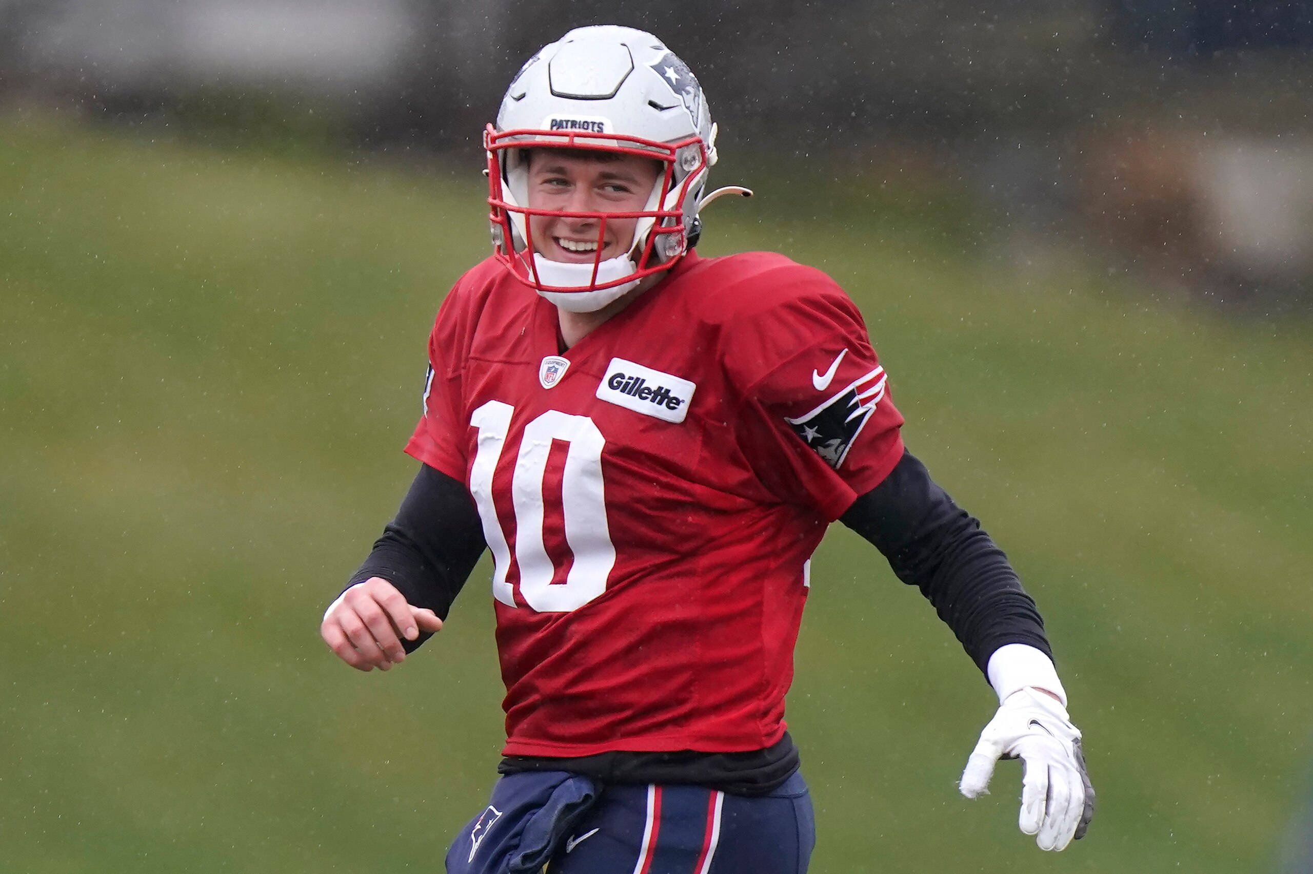 New England Patriots quarterback Mac Jones (10) warms up during an NFL football practice, Wednesday, Dec. 22, 2021, in Foxborough, Mass. (AP Photo/Steven Senne)