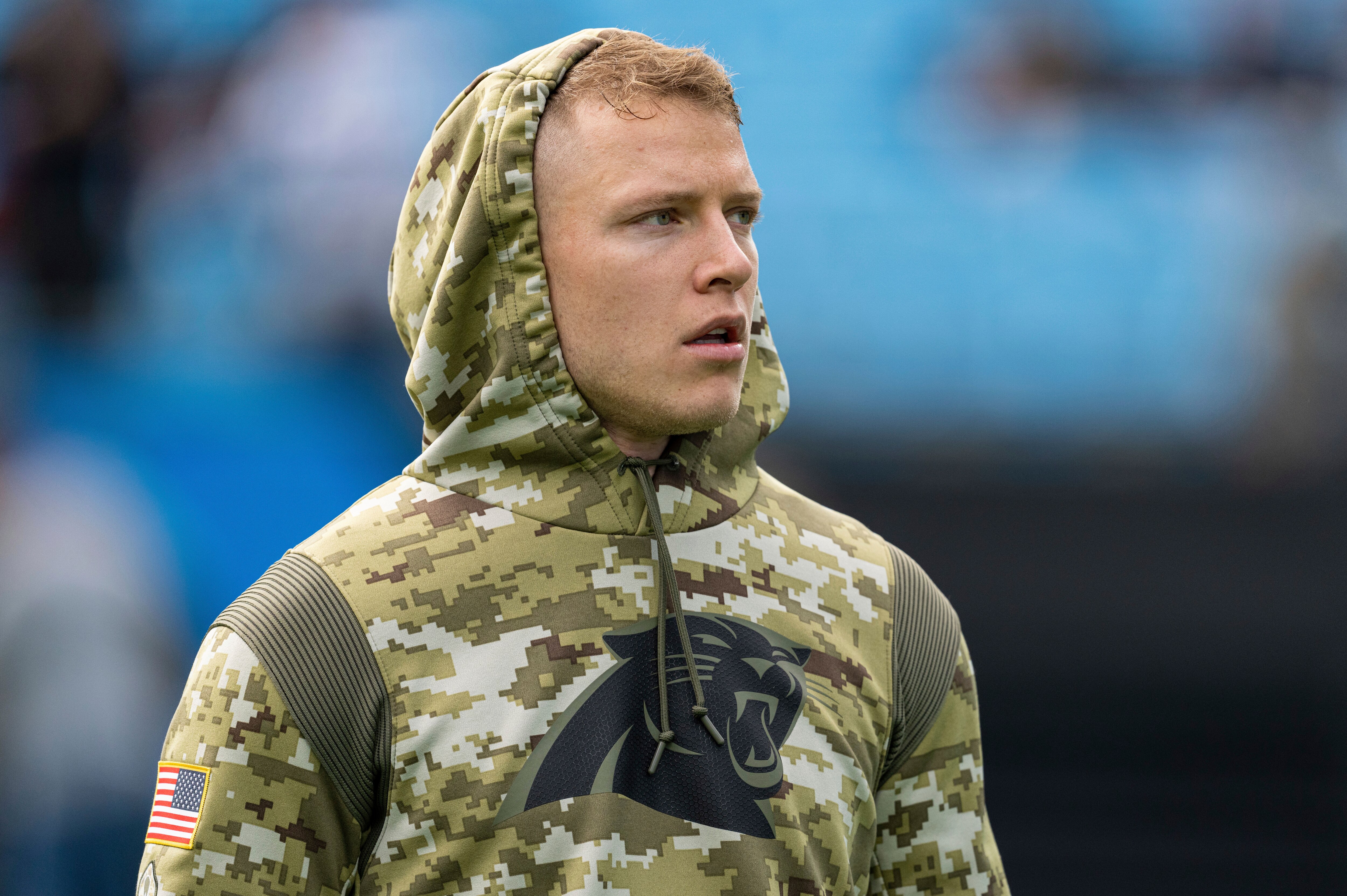 Carolina Panthers running back Christian McCaffrey (22) warms up before an NFL football game against the Washington Football Team Sunday, Nov. 21, 2021, in Charlotte, N.C. (AP Photo/Jacob Kupferman)
