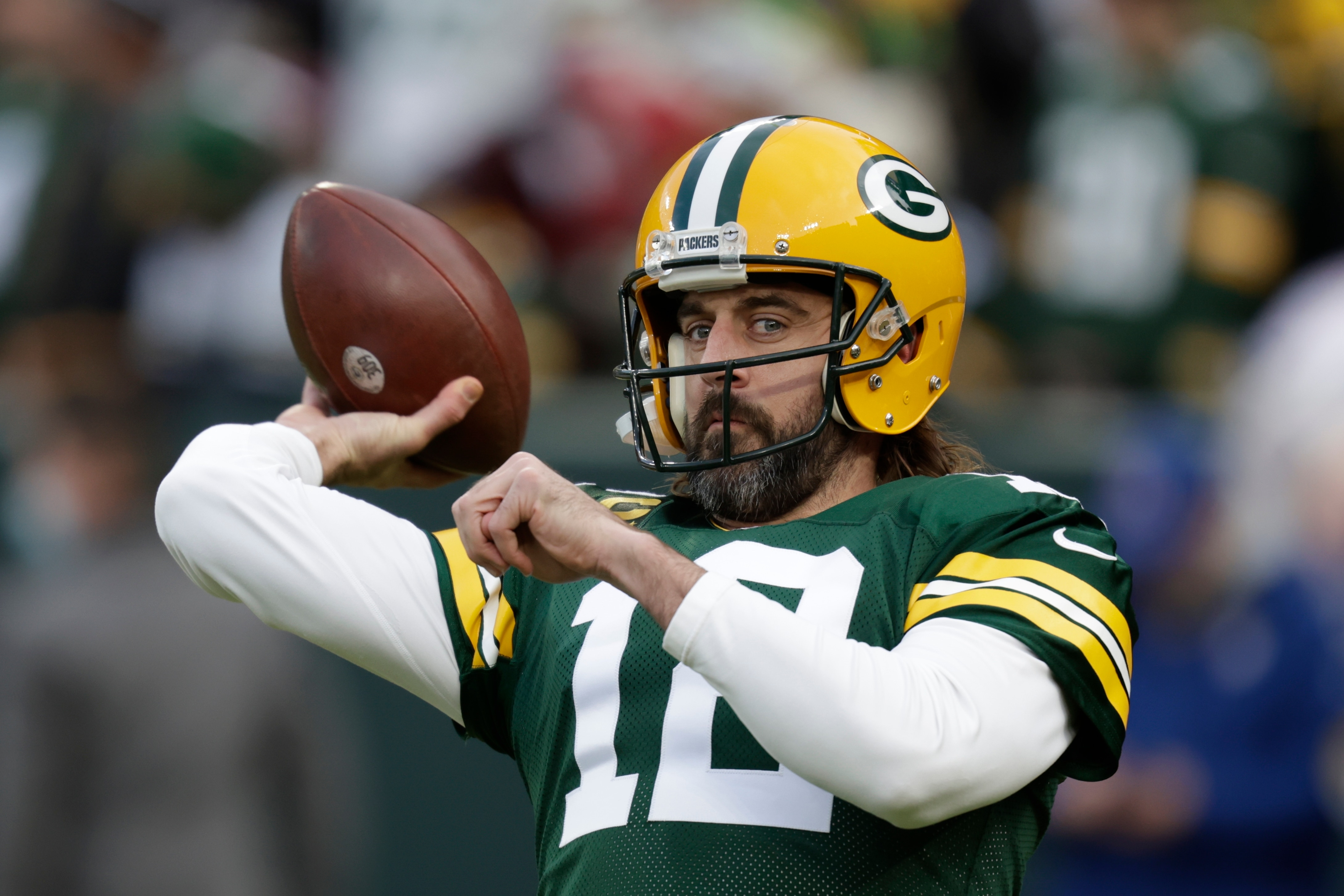 Green Bay Packers' Aaron Rodgers warms up before an NFL football game against the Cleveland Browns Saturday, Dec. 25, 2021, in Green Bay, Wis. (AP Photo/Matt Ludtke)