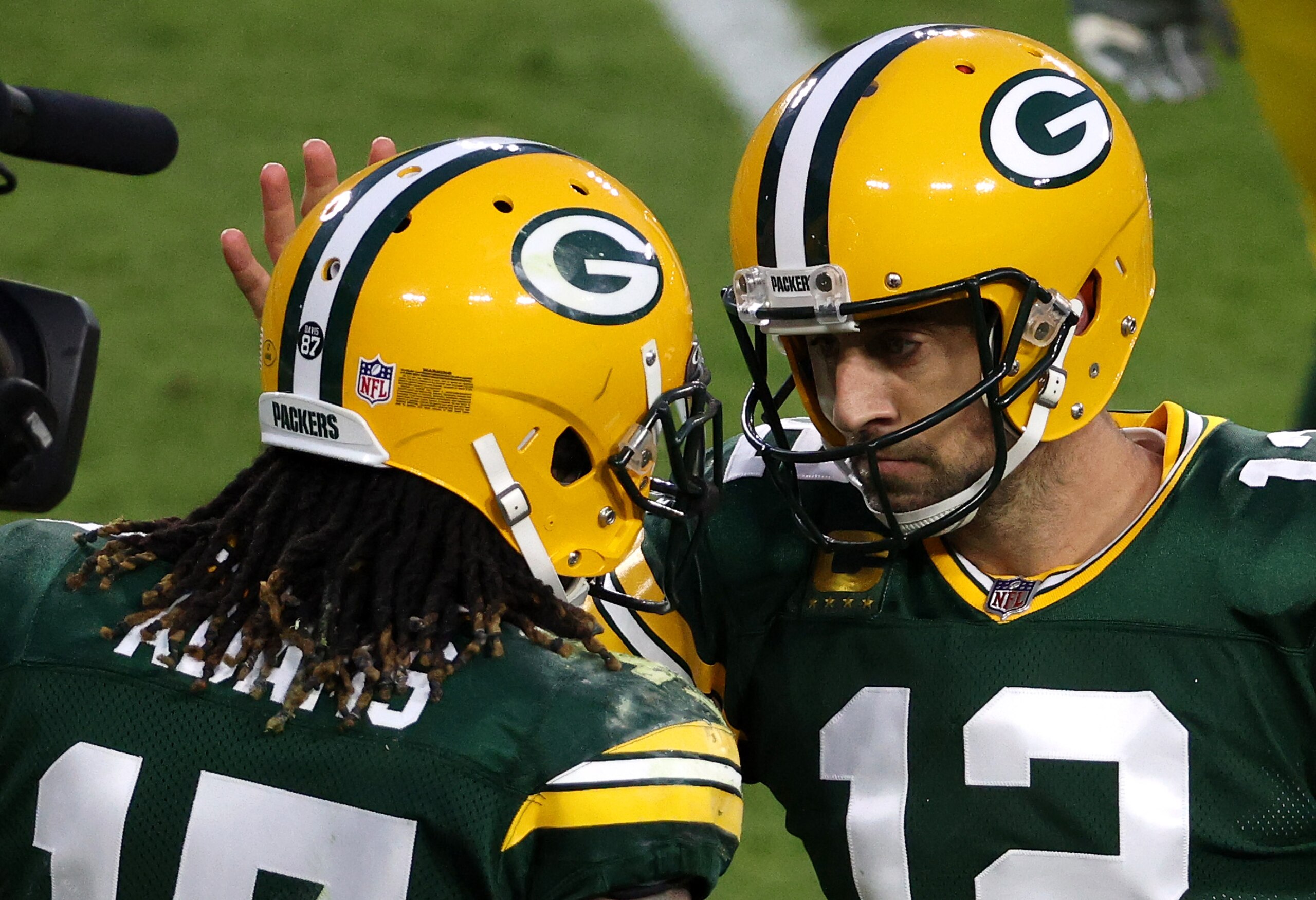 GREEN BAY, WISCONSIN - DECEMBER 06: Aaron Rodgers #12 of the Green Bay Packers celebrates with teammate Davante Adams #17 following their touchdown completion during the first quarter of their game against the Philadelphia Eagles at Lambeau Field on December 06, 2020 in Green Bay, Wisconsin. (Photo by Dylan Buell/Getty Images)