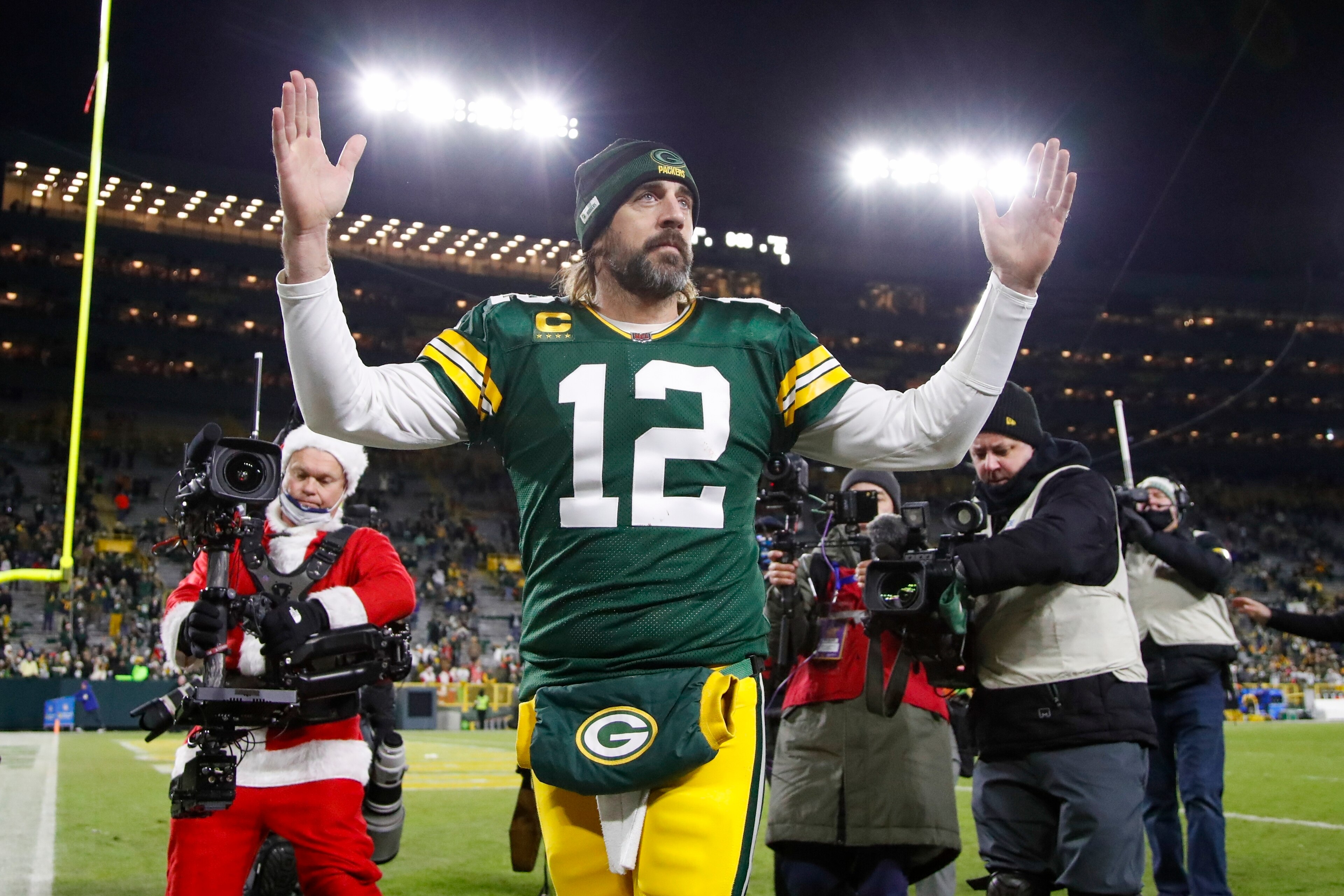 Green Bay Packers' Aaron Rodgers celebrates after an NFL football game against the Cleveland Browns Saturday, Dec. 25, 2021, in Green Bay, Wis. The Packers won 24-22. (AP Photo/Matt Ludtke) Green Bay Packers' Aaron Rodgers celebrates after an NFL football game against the Cleveland Browns Saturday, Dec. 25, 2021, in Green Bay, Wis. The Packers won 24-22. (AP Photo/Matt Ludtke)