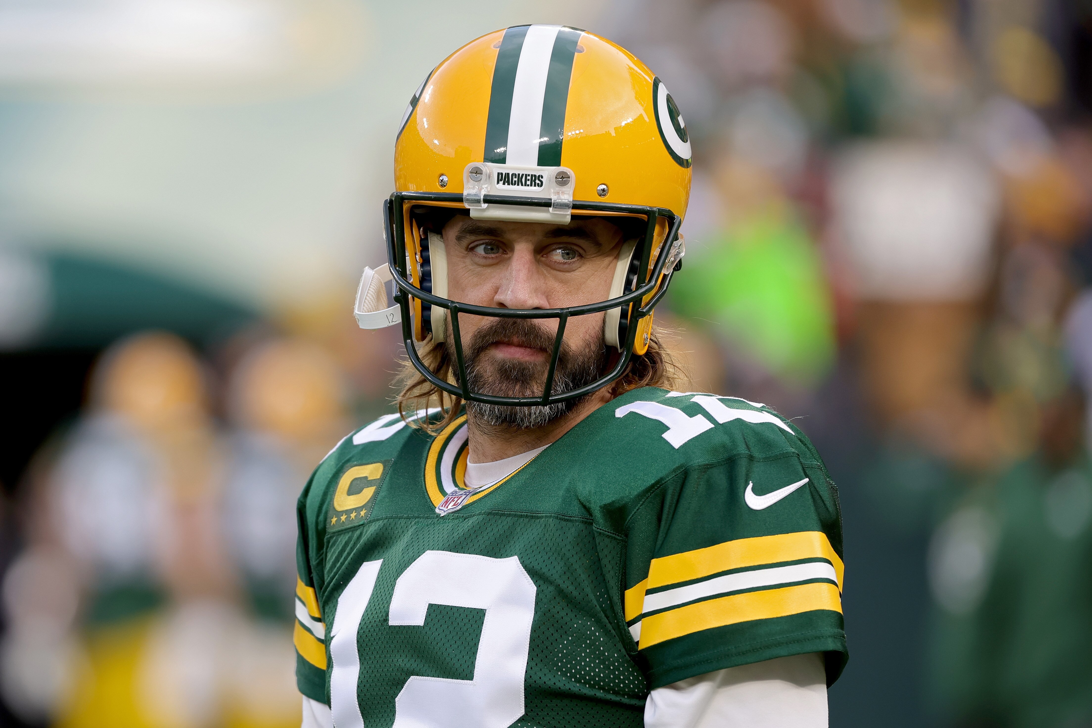 GREEN BAY, WISCONSIN - DECEMBER 25: Aaron Rodgers #12 of the Green Bay Packers looks on before the game against the Cleveland Browns at Lambeau Field on December 25, 2021 in Green Bay, Wisconsin. (Photo by Stacy Revere/Getty Images)