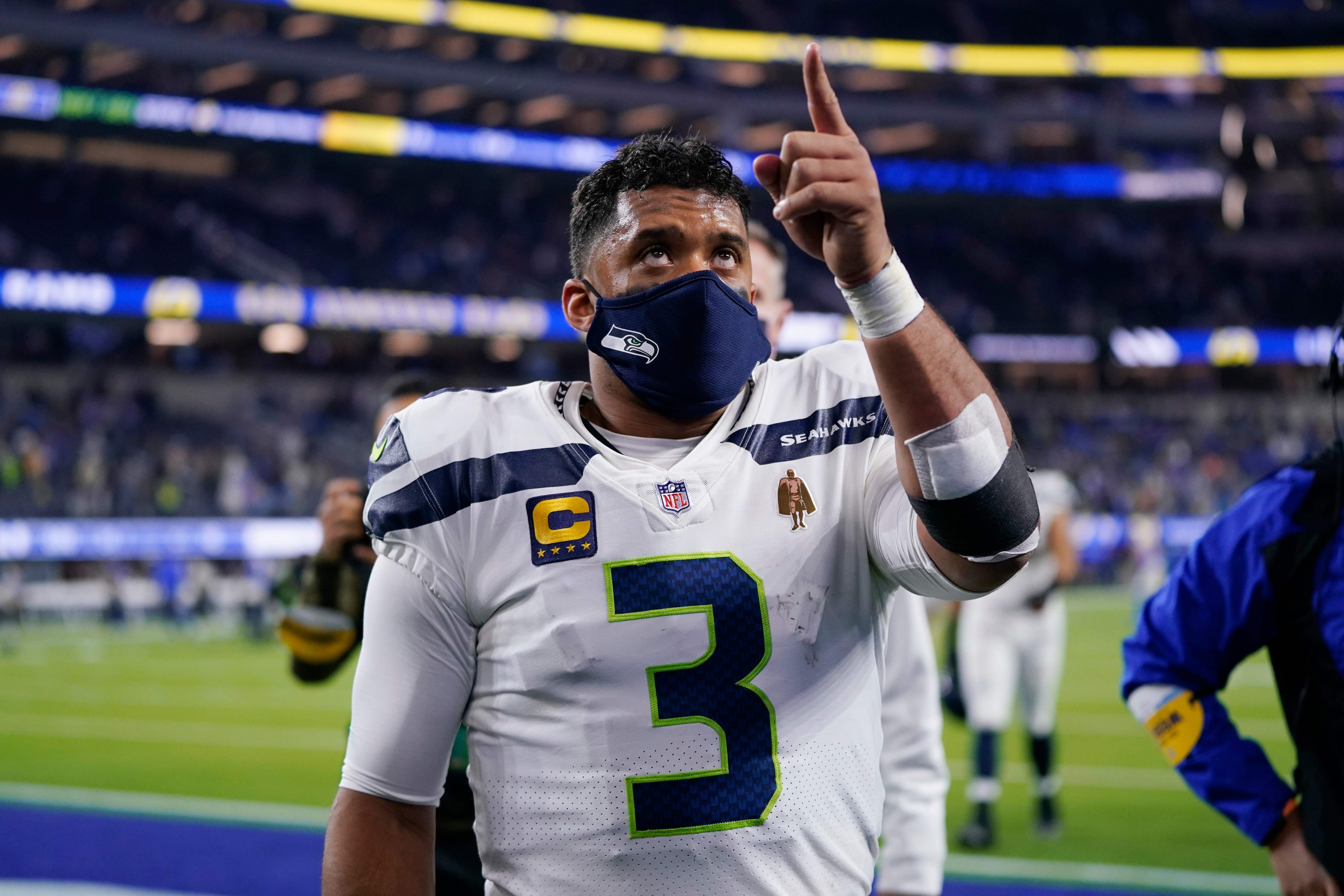 Seattle Seahawks quarterback Russell Wilson (3) walks off the field after a loss to the Los Angeles Rams during an NFL football game Wednesday, Dec. 22, 2021, in Inglewood, Calif. (AP Photo/Ashley Landis)