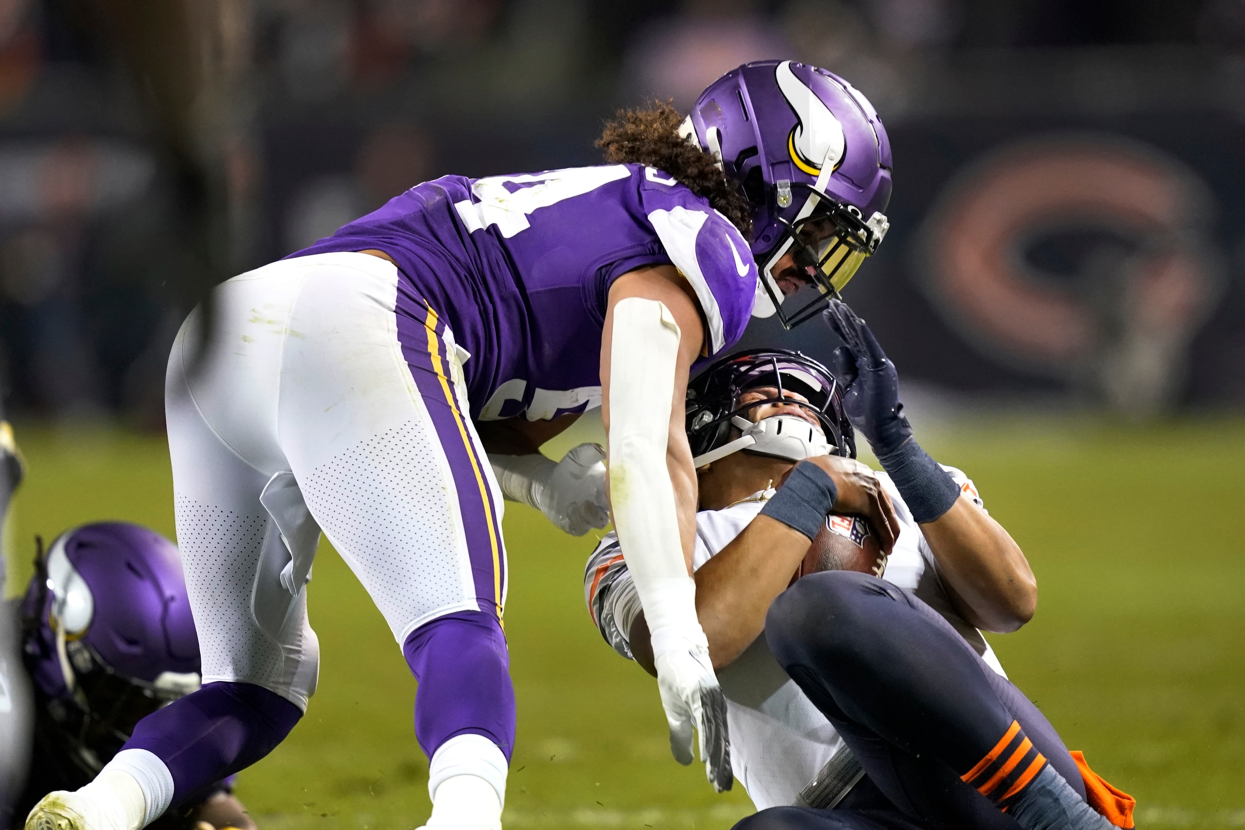 Minnesota Vikings middle linebacker Eric Kendricks hits Chicago Bears quarterback Justin Fields after Fields gave himself up during the second half of an NFL football game Monday, Dec. 20, 2021, in Chicago. Eric Kendricks was ejected from the game. (AP Photo/David Banks) Minnesota Vikings middle linebacker Eric Kendricks hits Chicago Bears quarterback Justin Fields after Fields gave himself up during the second half of an NFL football game Monday, Dec. 20, 2021, in Chicago. Eric Kendricks was ejected from the game. (AP Photo/David Banks)