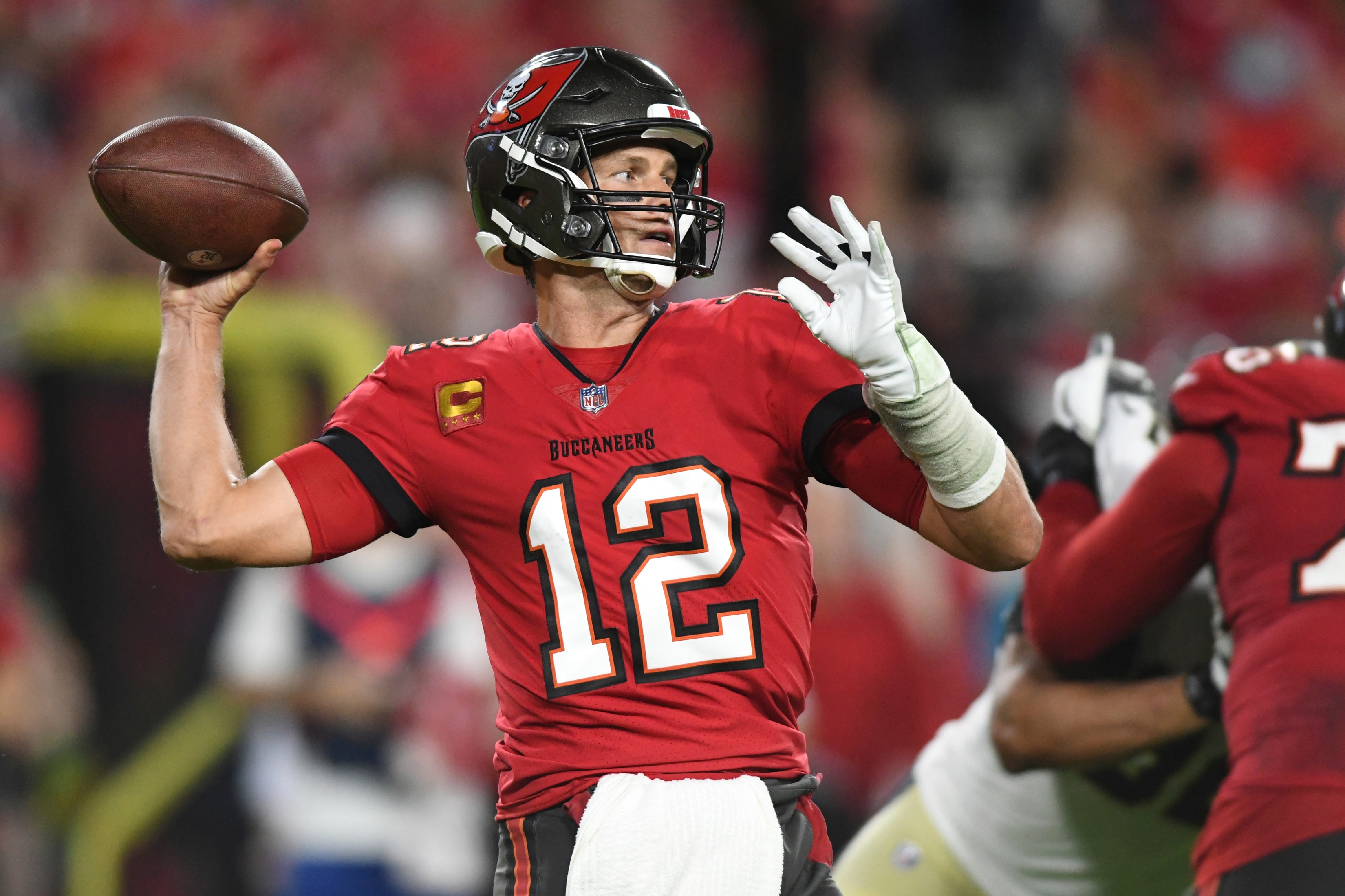 Tampa Bay Buccaneers quarterback Tom Brady (12) throws a pass against the New Orleans Saints during the first half of an NFL football game Sunday, Dec. 19, 2021, in Tampa, Fla. (AP Photo/Jason Behnken)
