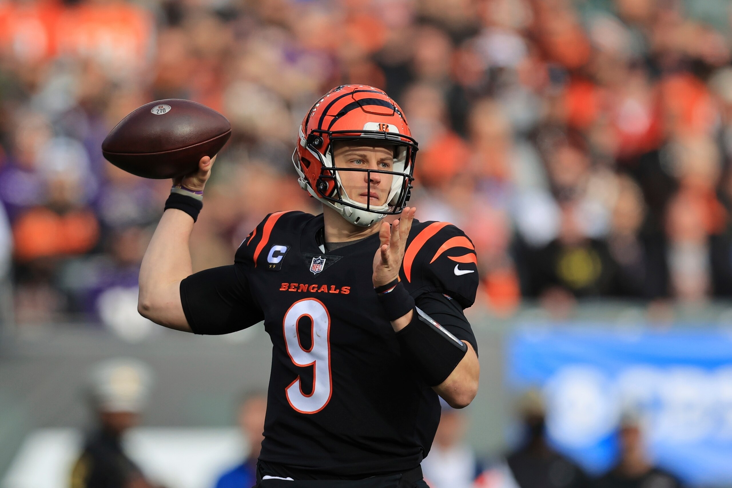 Cincinnati Bengals quarterback Joe Burrow (9) throws during the first half of an NFL football game against the Baltimore Ravens, Sunday, Dec. 26, 2021, in Cincinnati. (AP Photo/Aaron Doster)