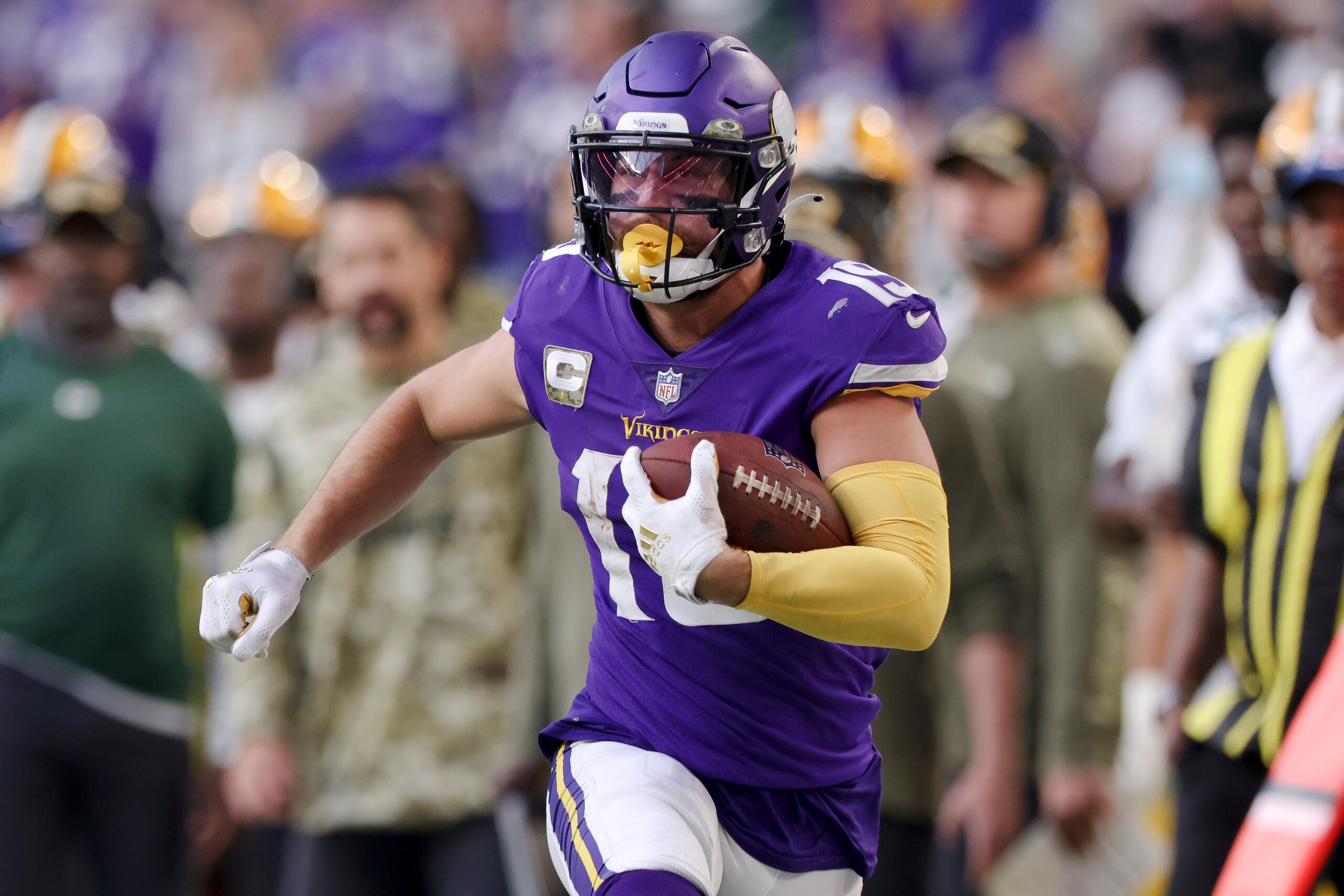 Minnesota Vikings wide receiver Adam Thielen (19) carries the ball during the second half of an NFL football game against the Green Bay Packers, Sunday, Nov. 21, 2021 in Minneapolis. Minnesota won 34-31. (AP Photo/Stacy Bengs)