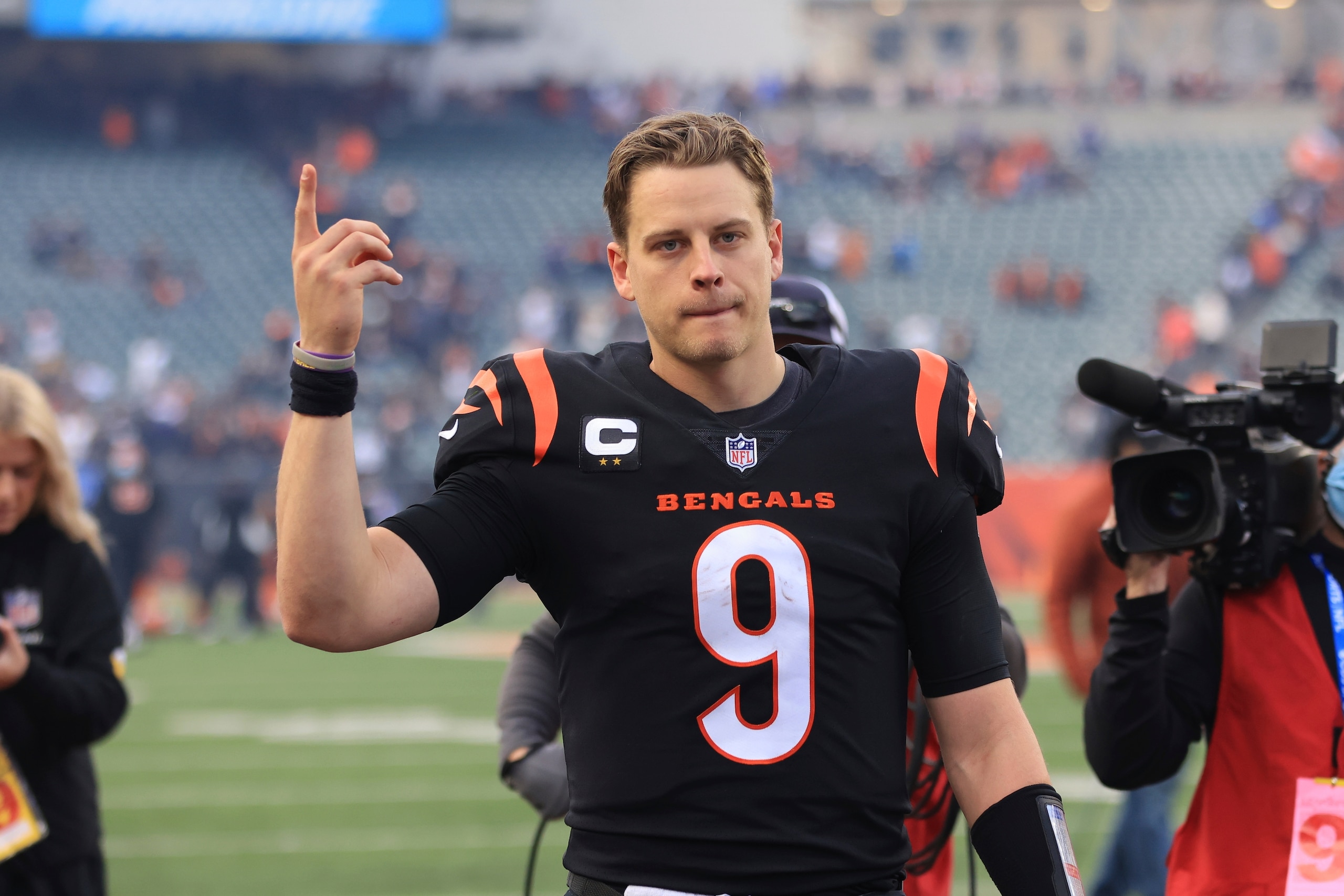 Cincinnati Bengals' Joe Burrow celebrates as he leaves the field following an NFL football game against the Baltimore Ravens, Sunday, Dec. 26, 2021, in Cincinnati. (AP Photo/Aaron Doster)