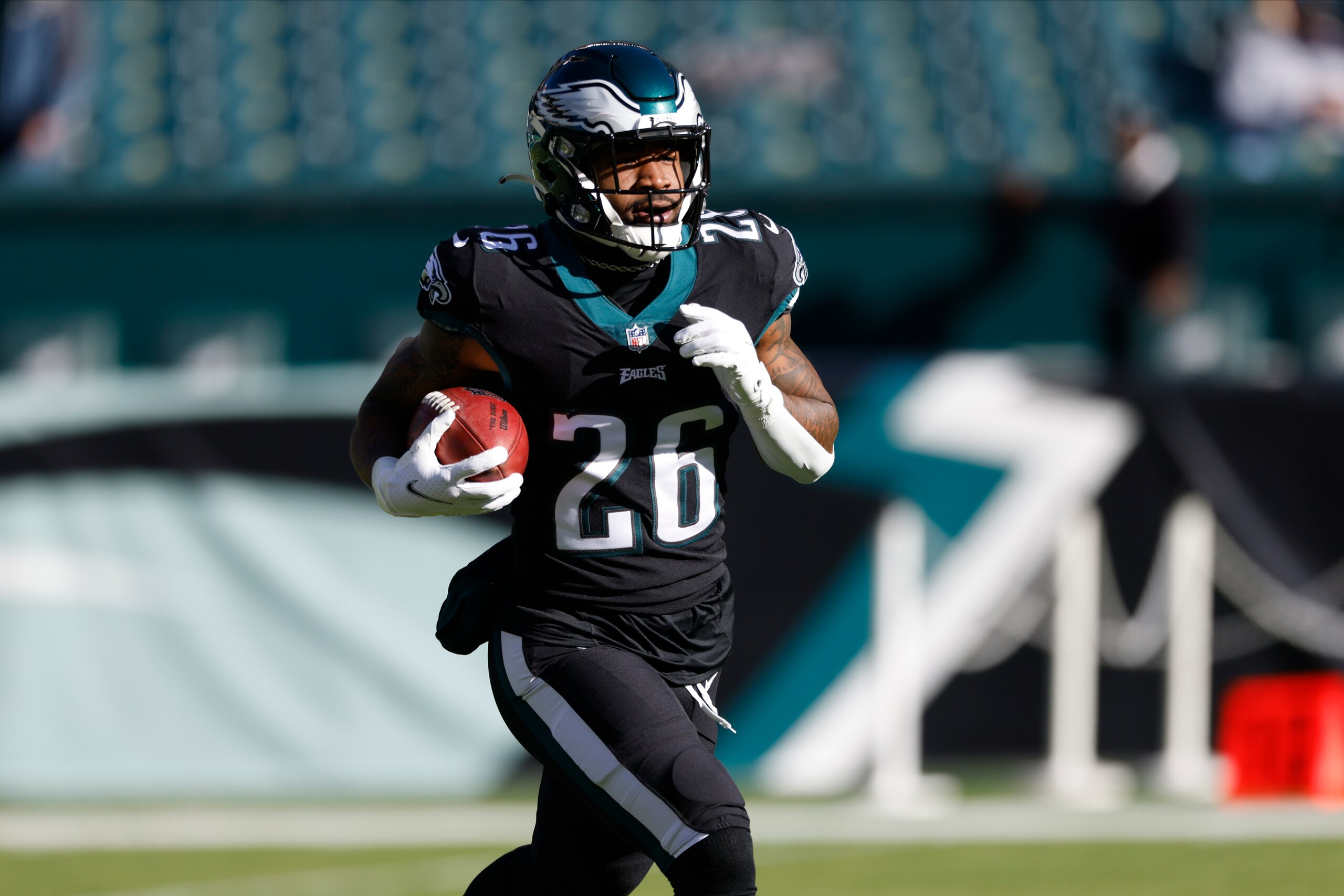 Philadelphia Eagles' Miles Sanders warms up before an NFL football game against the New York Giants, Sunday, Dec. 26, 2021, in Philadelphia. (AP Photo/Laurence Kesterson)