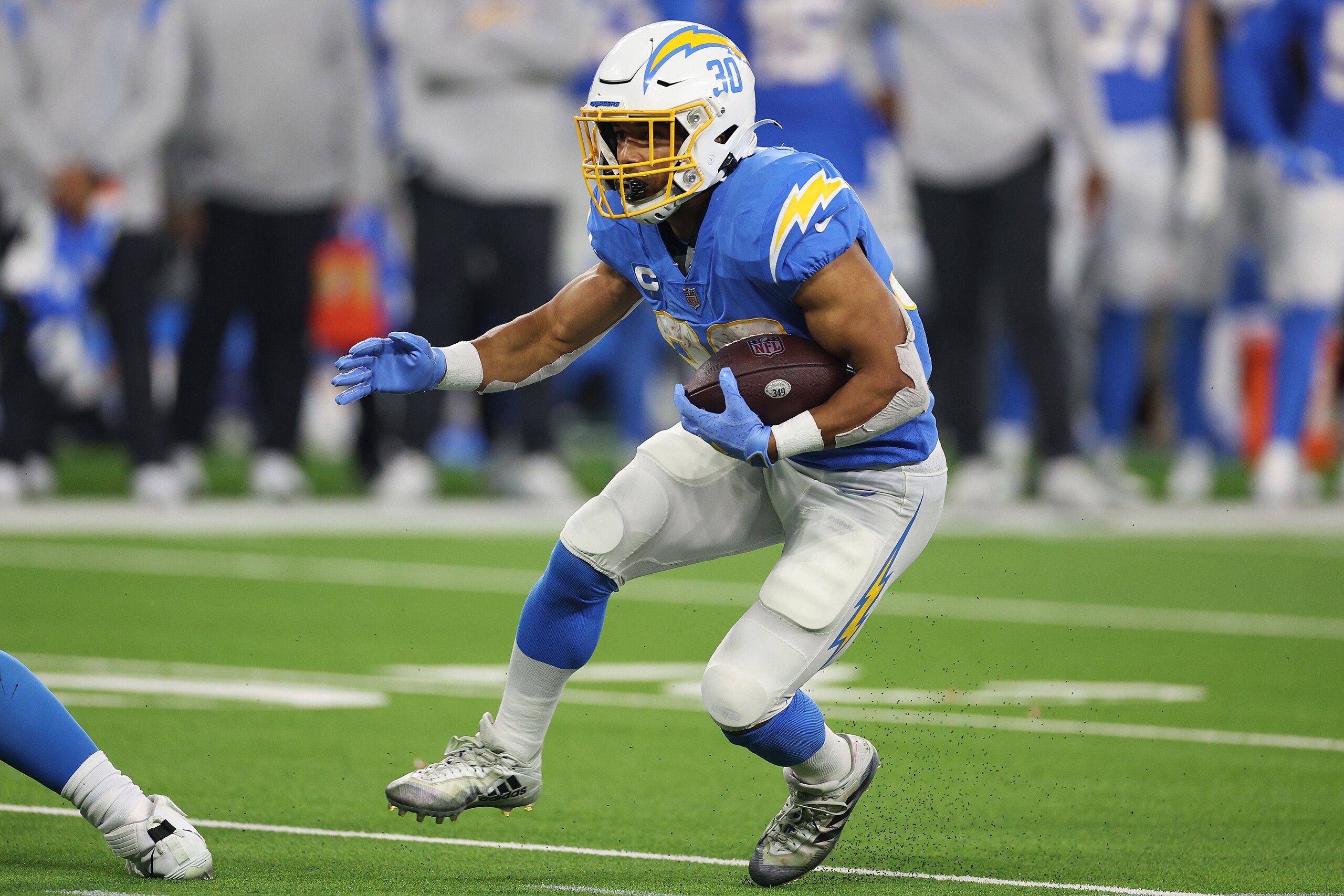 INGLEWOOD, CALIFORNIA - DECEMBER 16: Austin Ekeler #30 of the Los Angeles Chargers carries the ball against the Kansas City Chiefs during the second half at SoFi Stadium on December 16, 2021 in Inglewood, California. (Photo by Harry How/Getty Images)