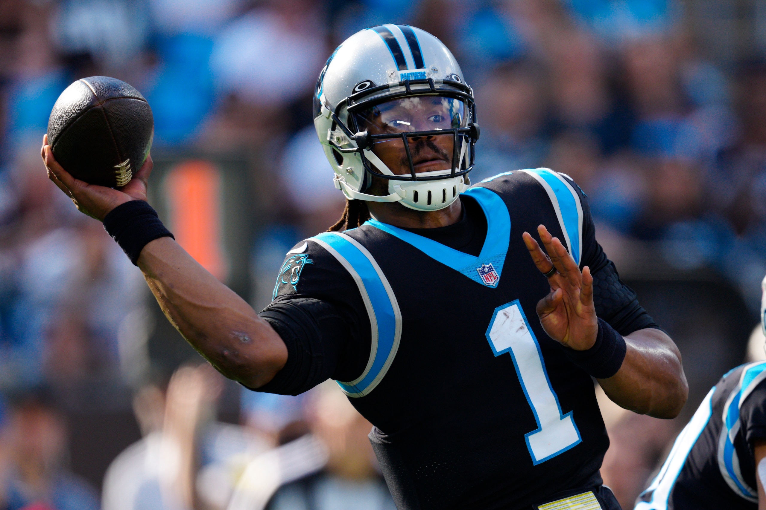 Carolina Panthers quarterback Cam Newton passes against the Tampa Bay Buccaneers during the first half of an NFL football game Sunday, Dec. 26, 2021, in Charlotte, N.C. (AP Photo/Jacob Kupferman)